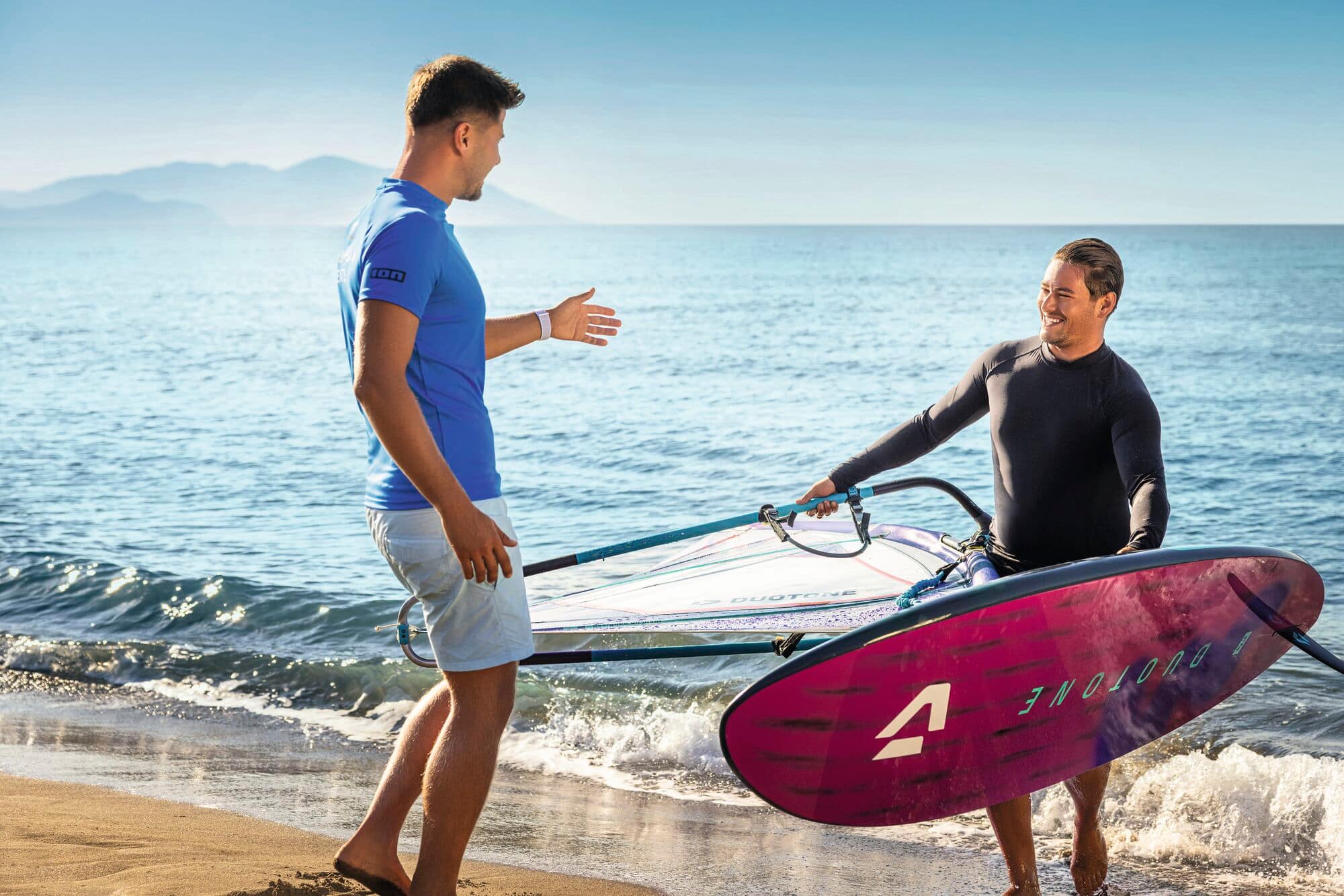 A Sport instructor providing tuition on wind surfing.