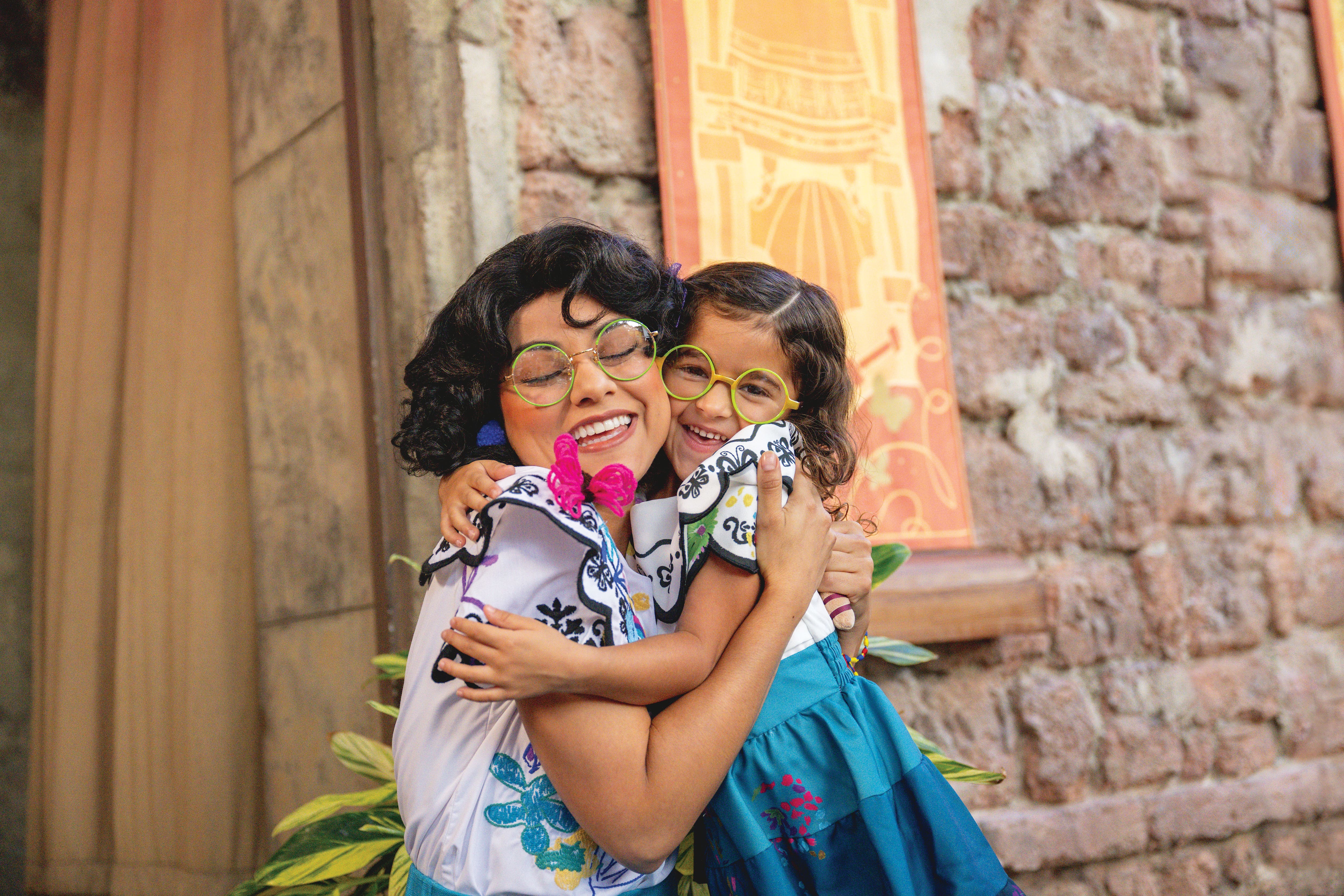 A child smiling with Mirabel.