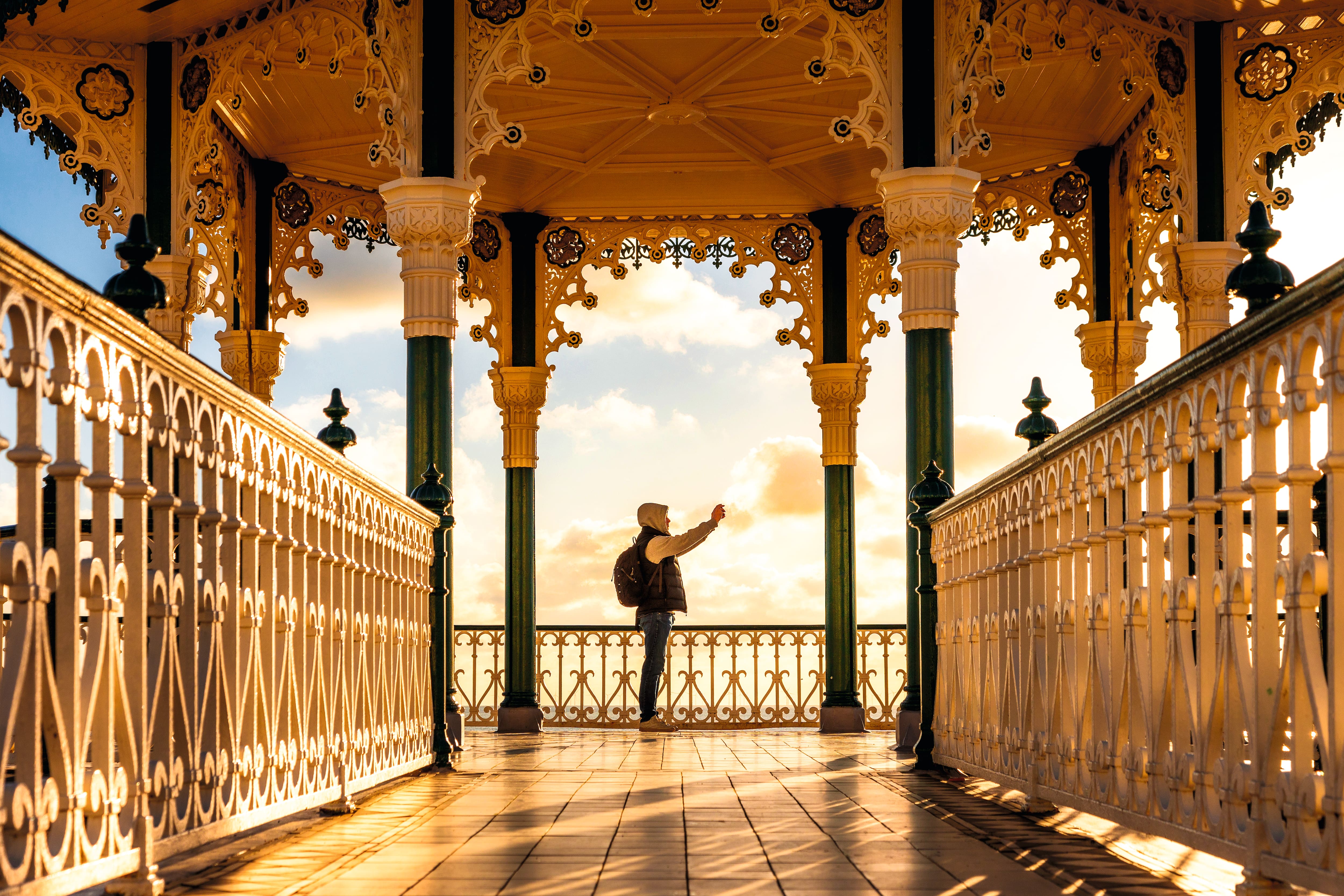 Person using mobile phone on Brighton Pier