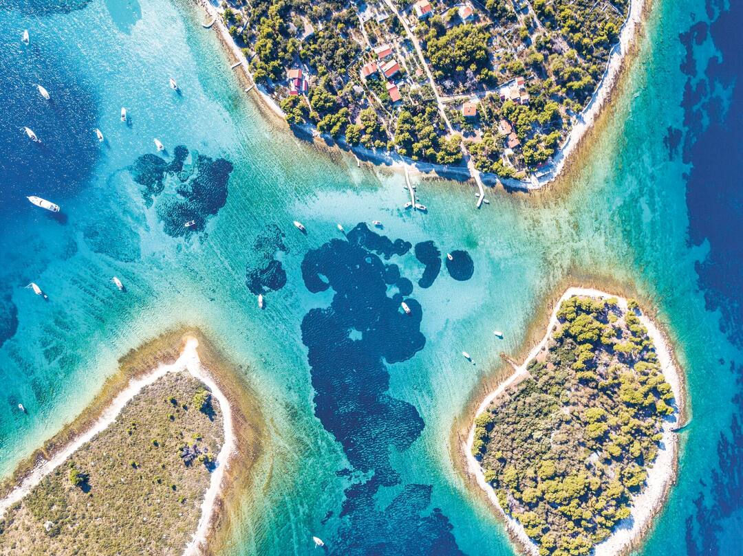 Ariel view of popular Blue Lagoon - Krknjasi near town Trogir, in the Adriatic sea, Croatia