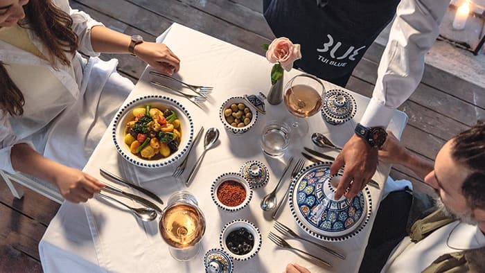 Overhead of different food on a table.