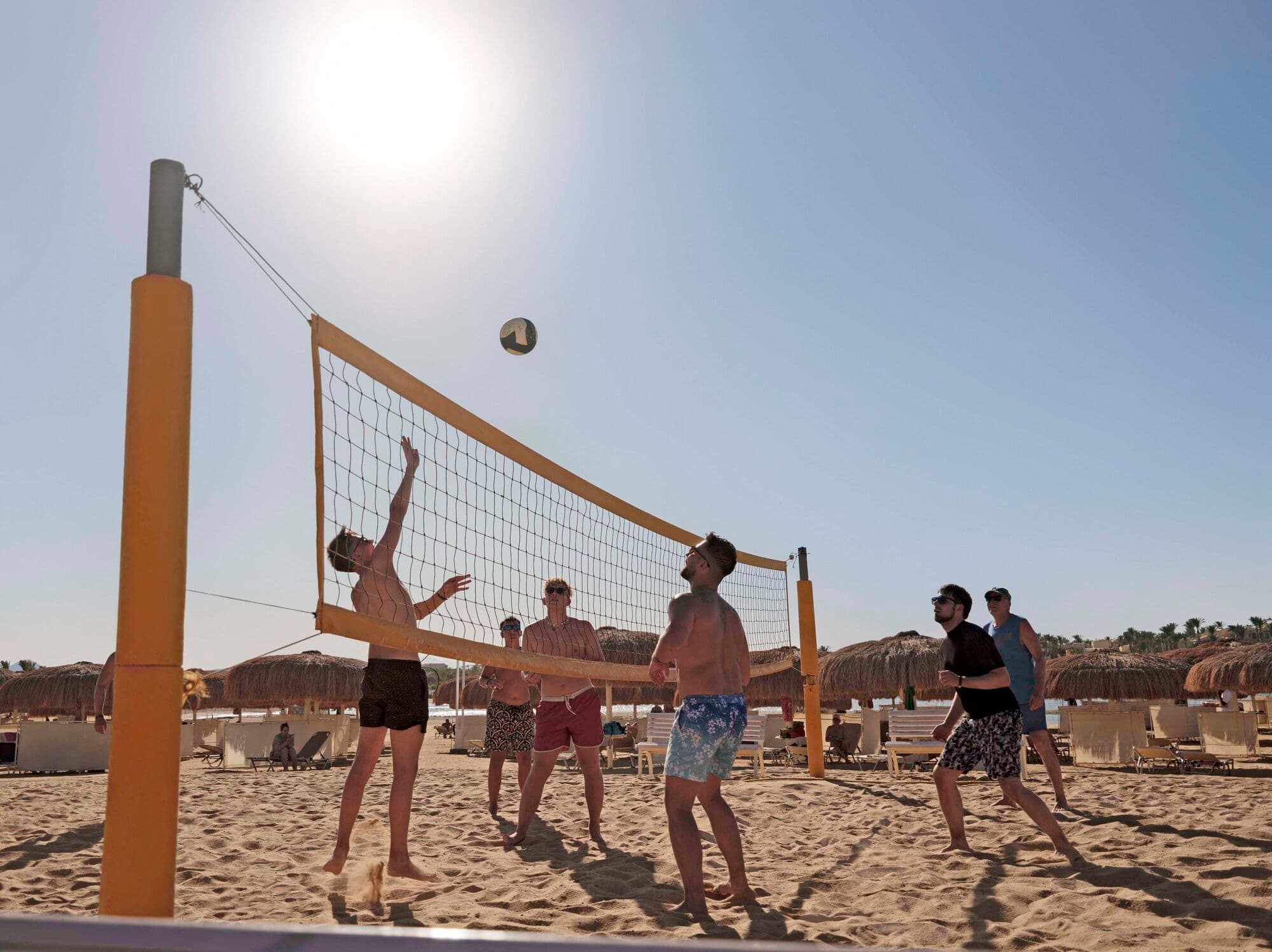 A group of men play beach volleyball at TUI Blue Samaya.