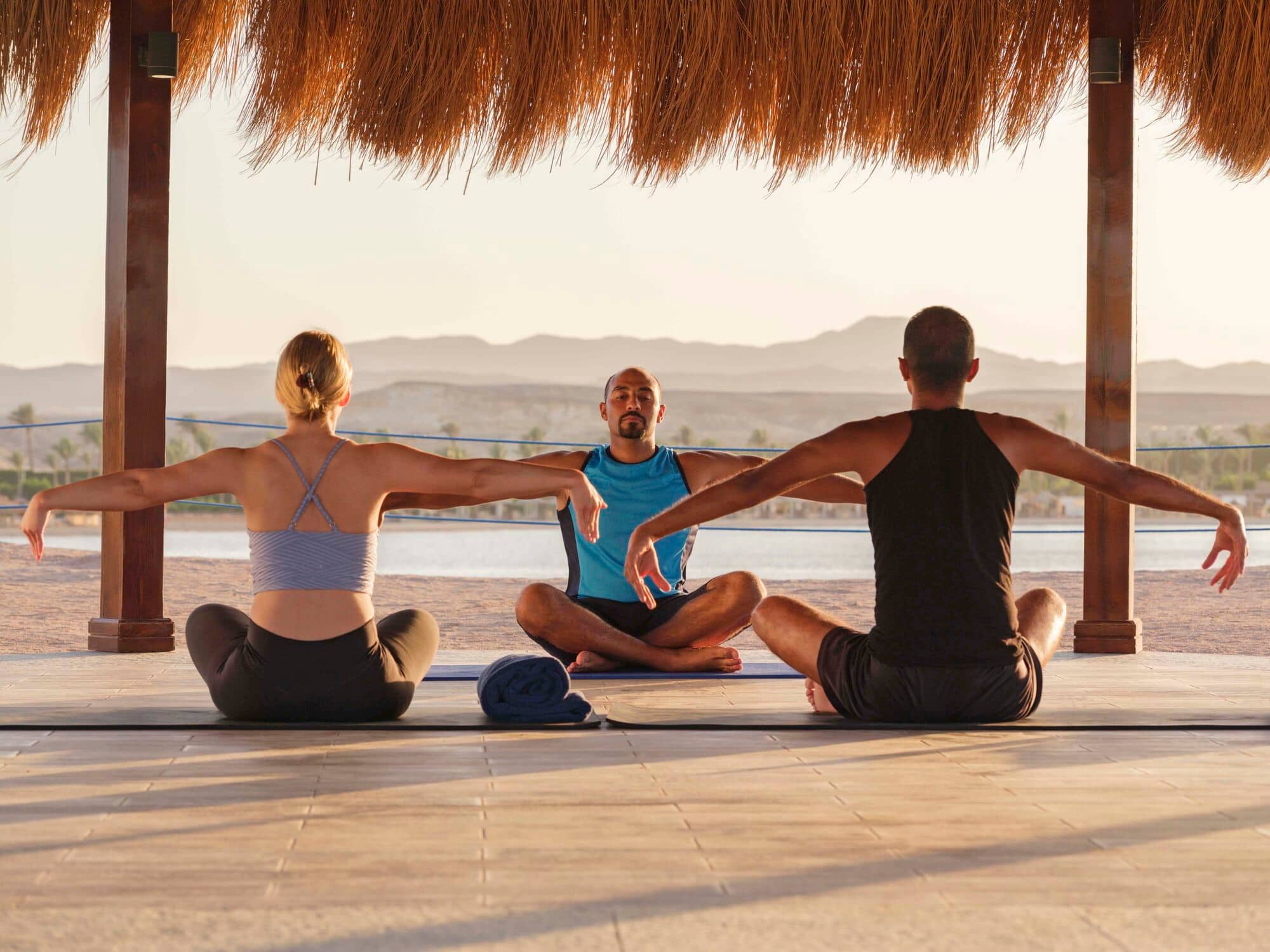 Guests take part in a sunset yoga class at Jaz Samaya Resort.
