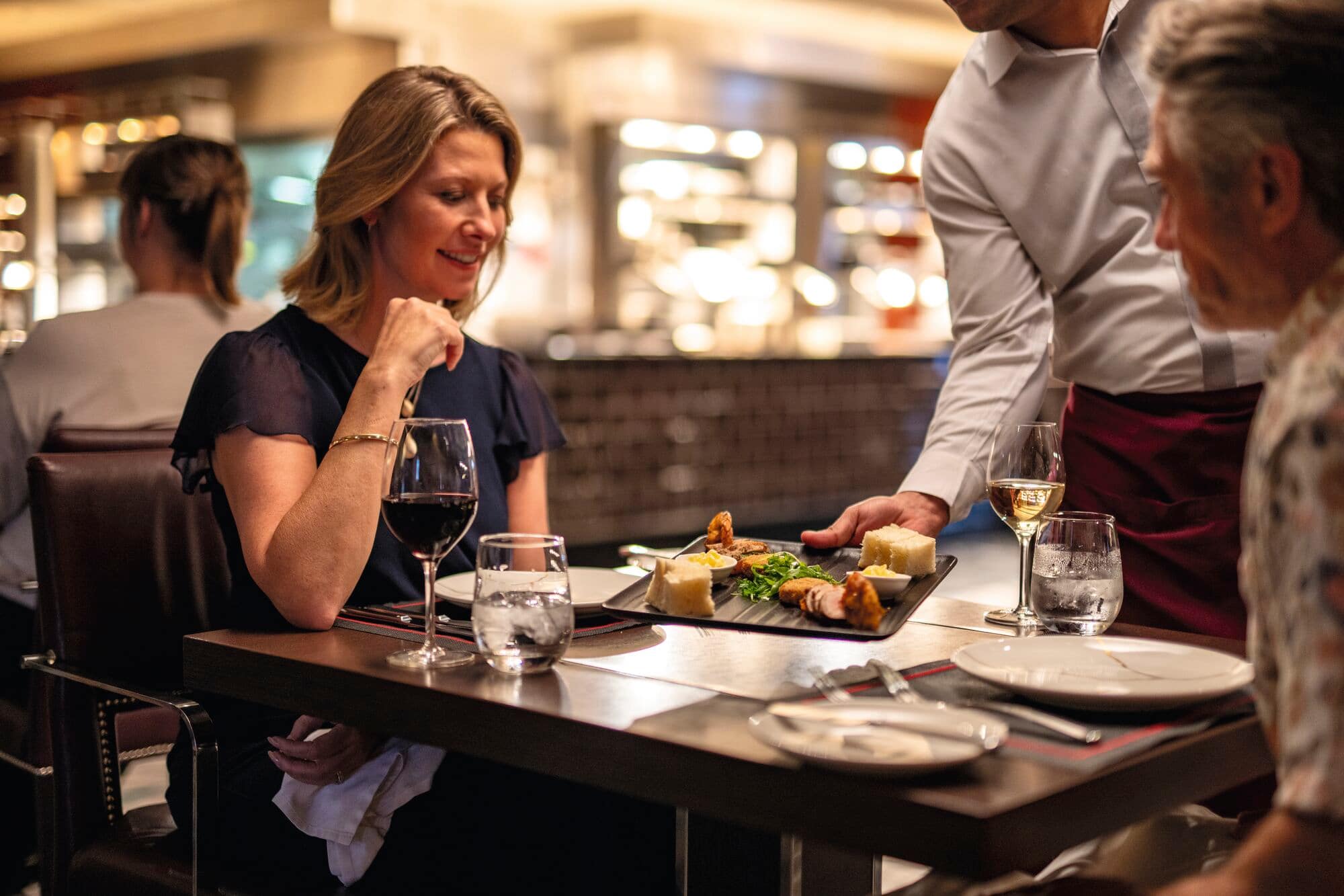 A couple dining at the Surf & Turf Steakhouse.