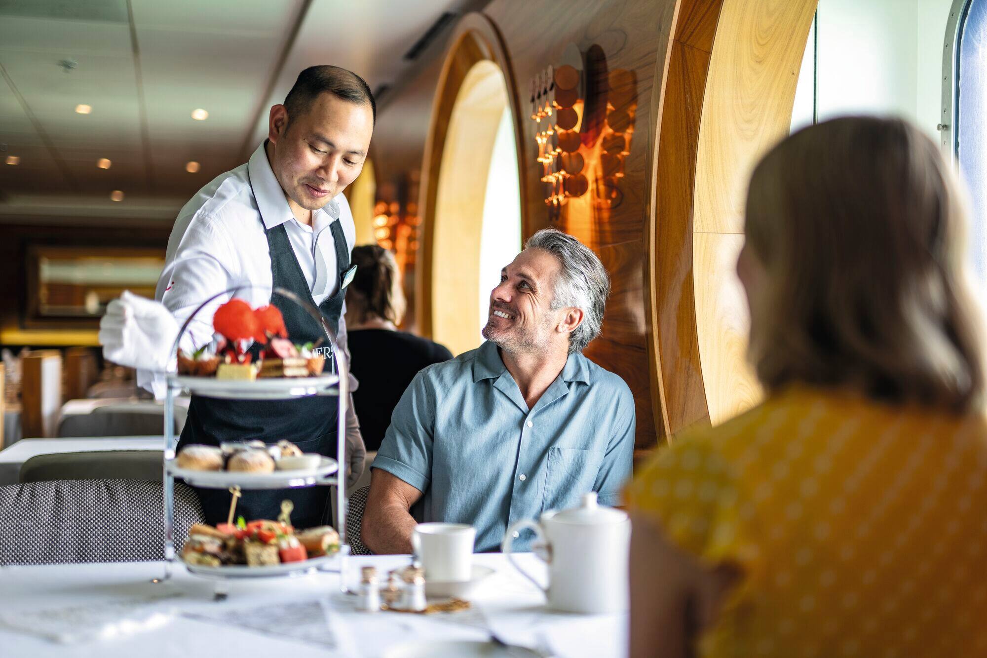 A couple having afternoon tea.