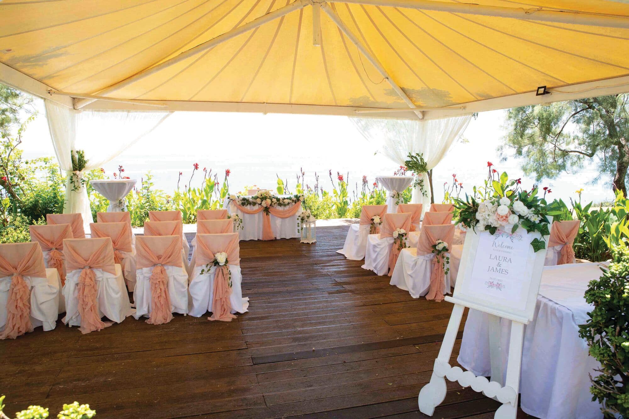 Decorated wedding guest chairs and flowers.