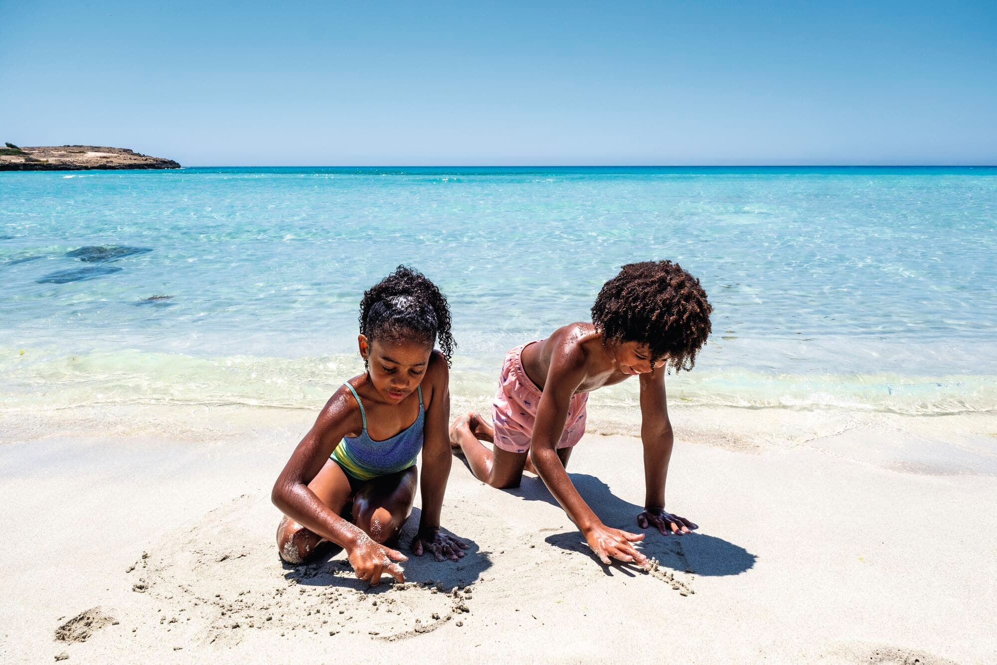 Children playing in the sand.