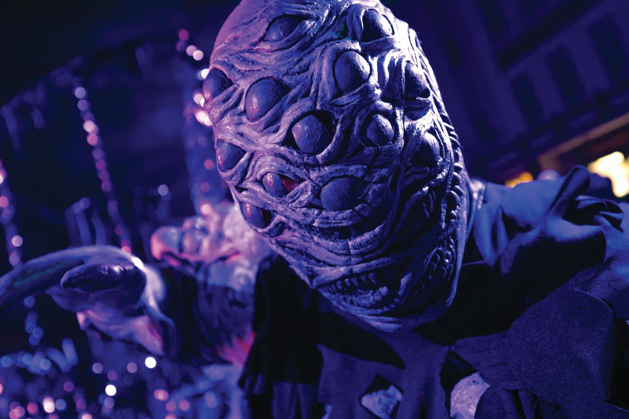 A monster with sharp teeth and lots of eyes.