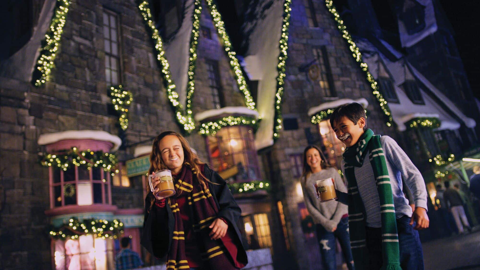 People in Harry Potter themed clothing, drinking butter beer in Diagon Alley.