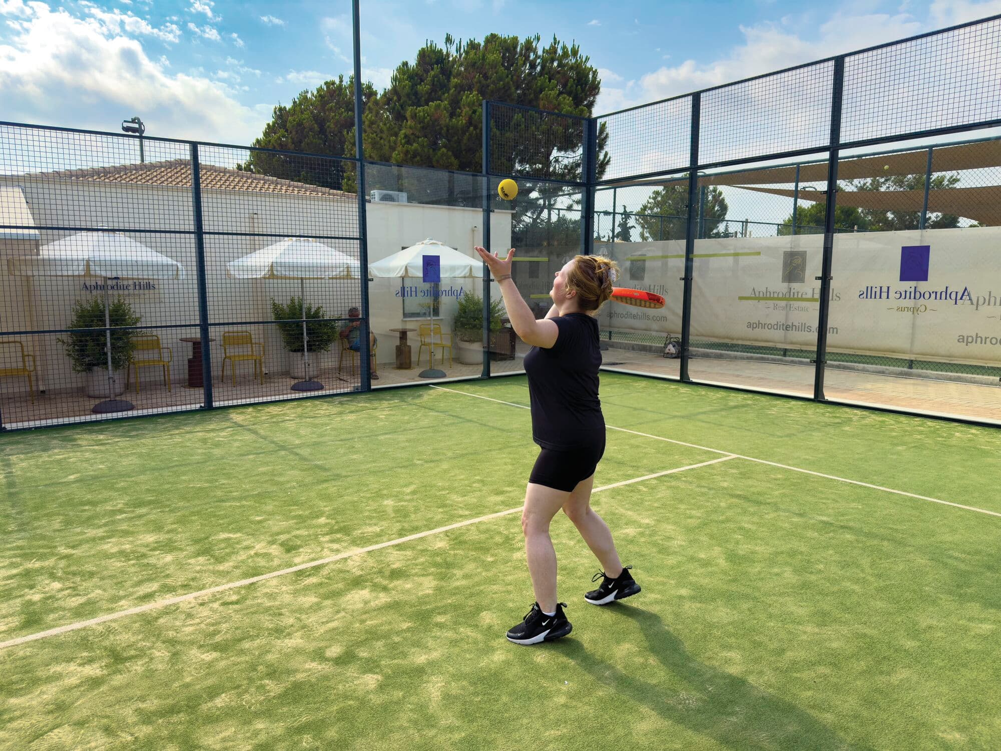 Lucy playing padel tennis on holiday.
