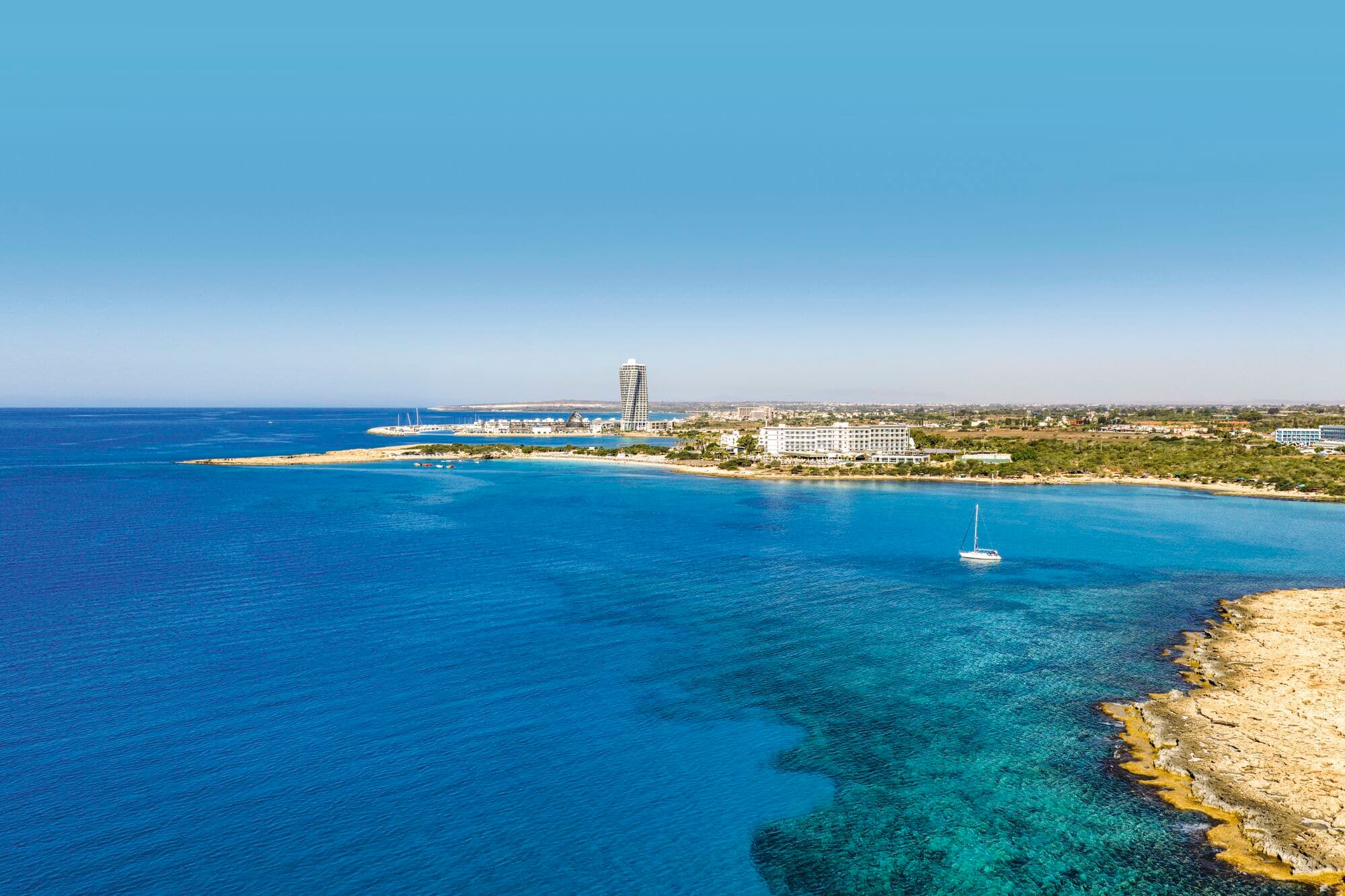Aeria view over Nissi Beach coastal bay.