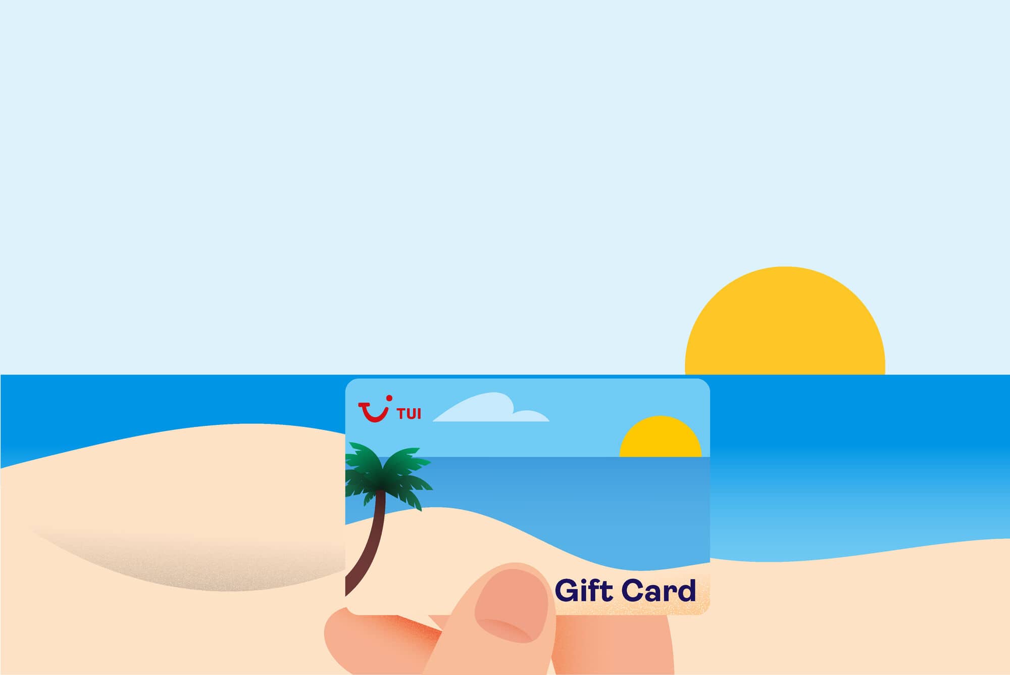 A TUI Gift Card in the sand.