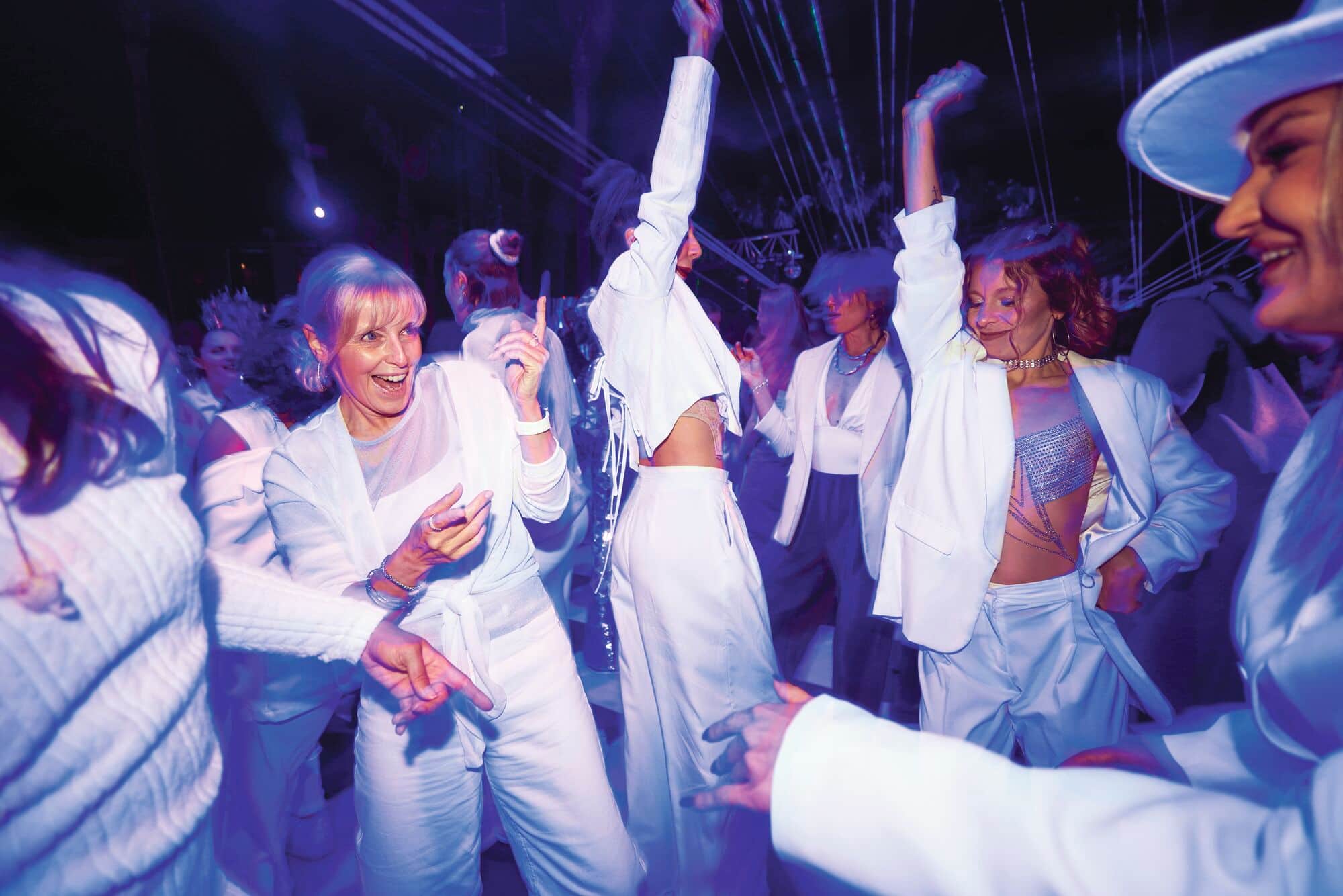People at a party dressed all in white. 
