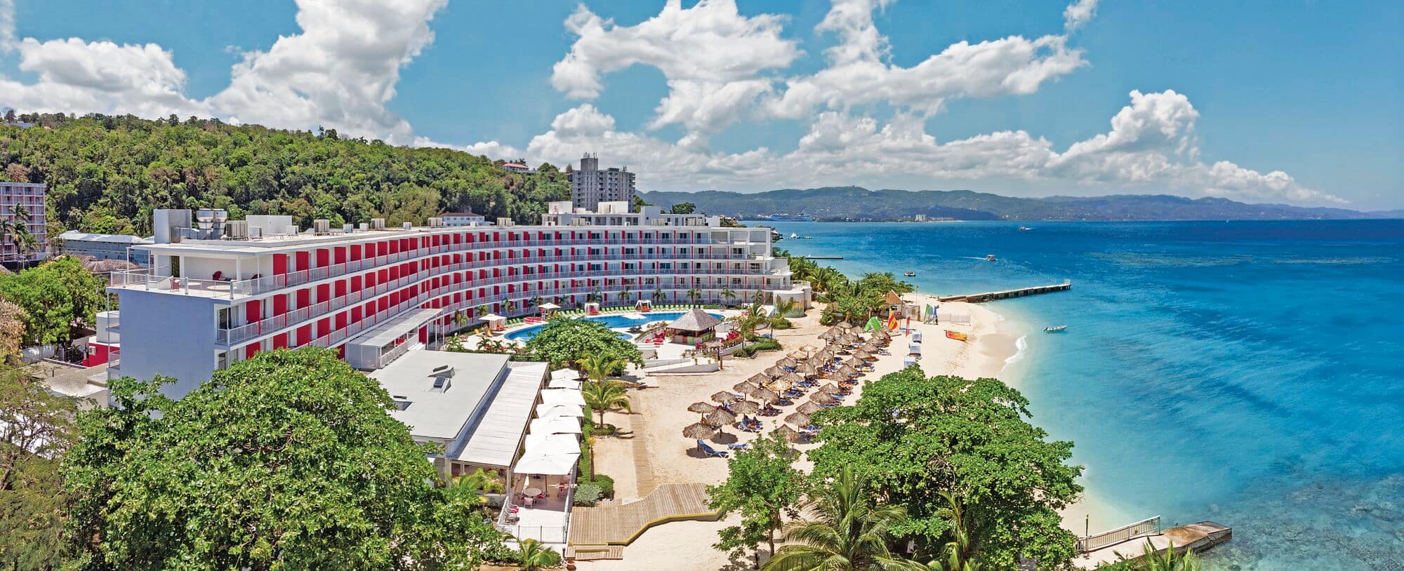 A crescent-shaped hotel looks out to Montego Bay, Jamaica.