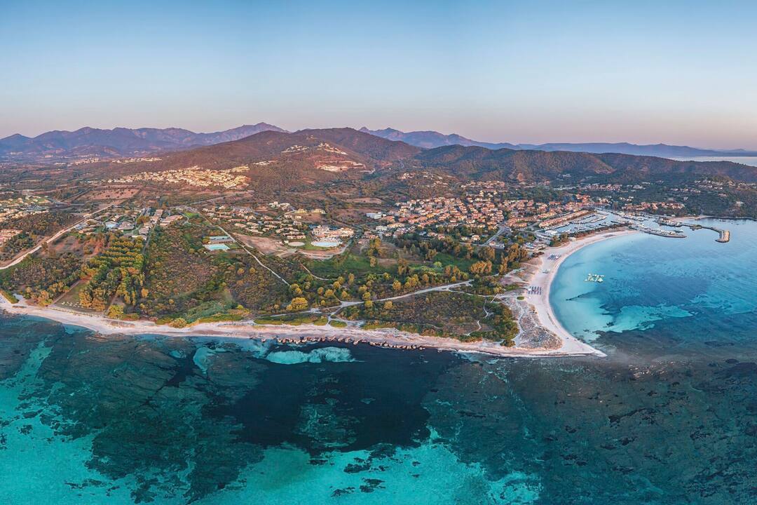 An aerial view of the resort and the coast