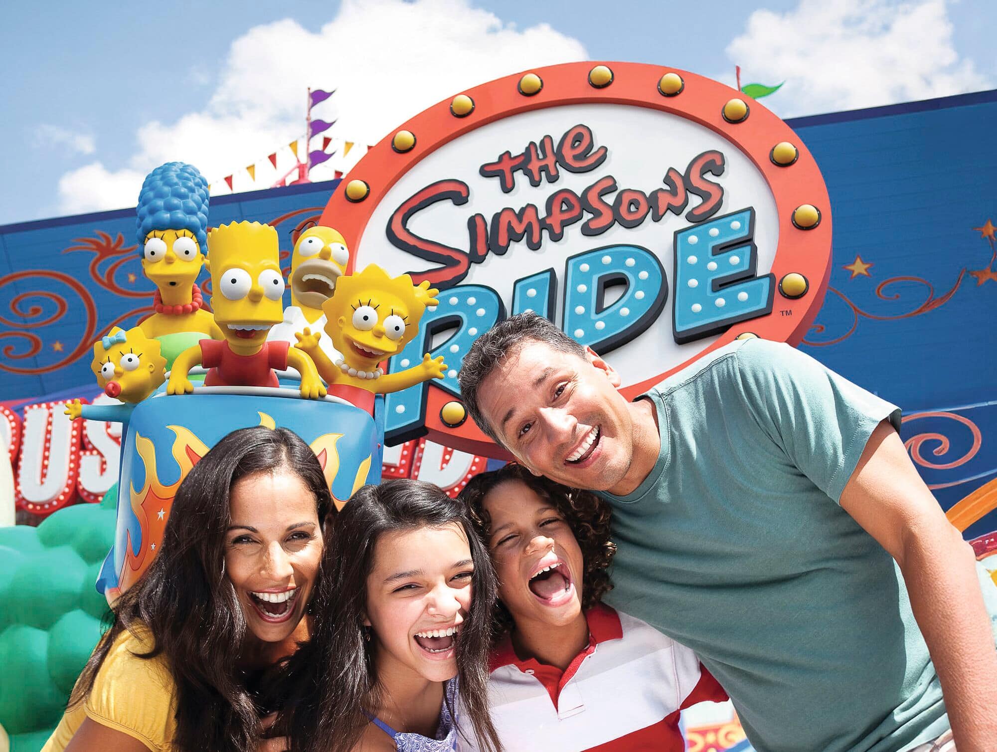 Family members smile at the entrance to The Simpsons Ride at Universal Studios Florida. 