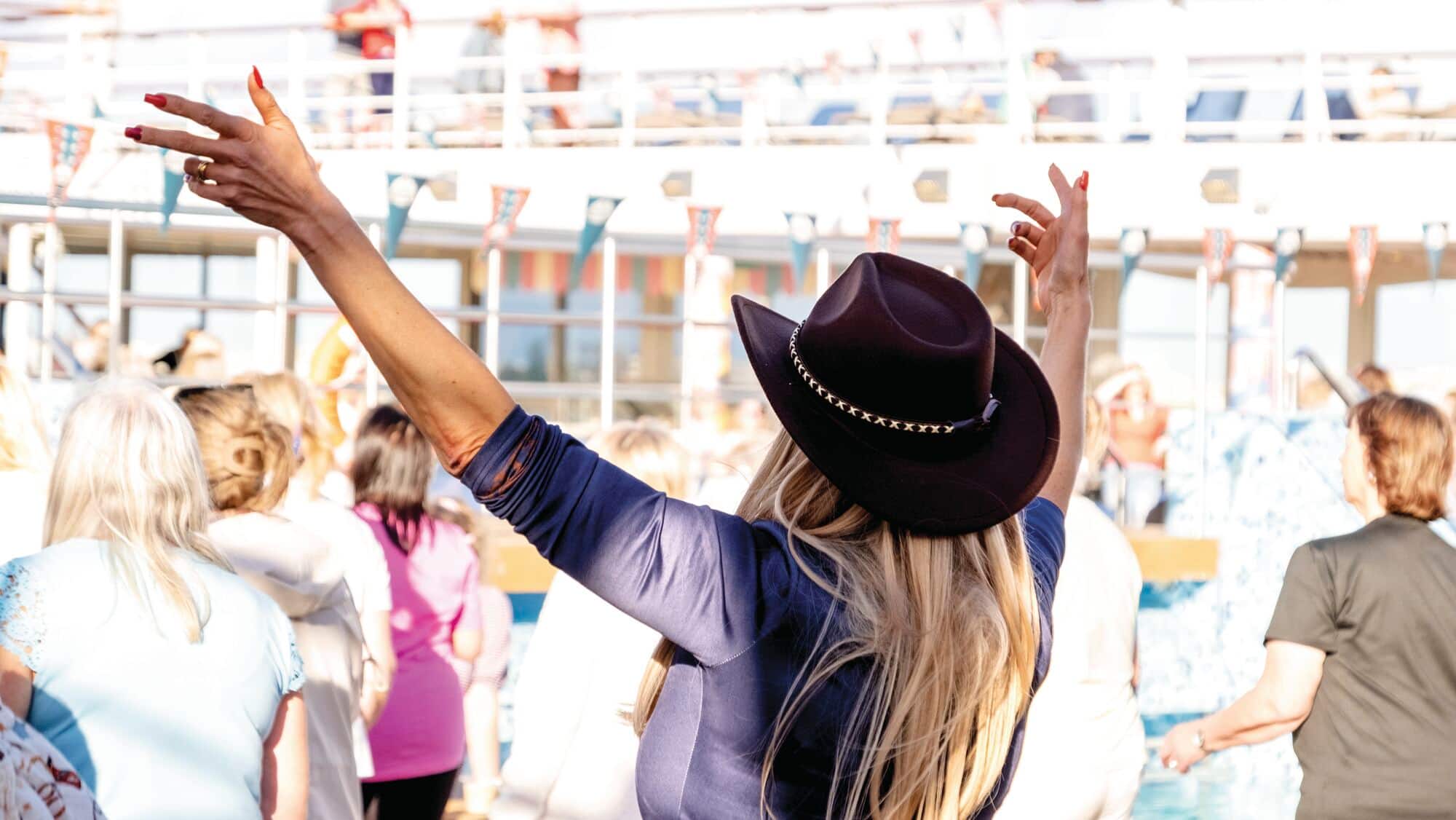 An audience at an onboard country music show.