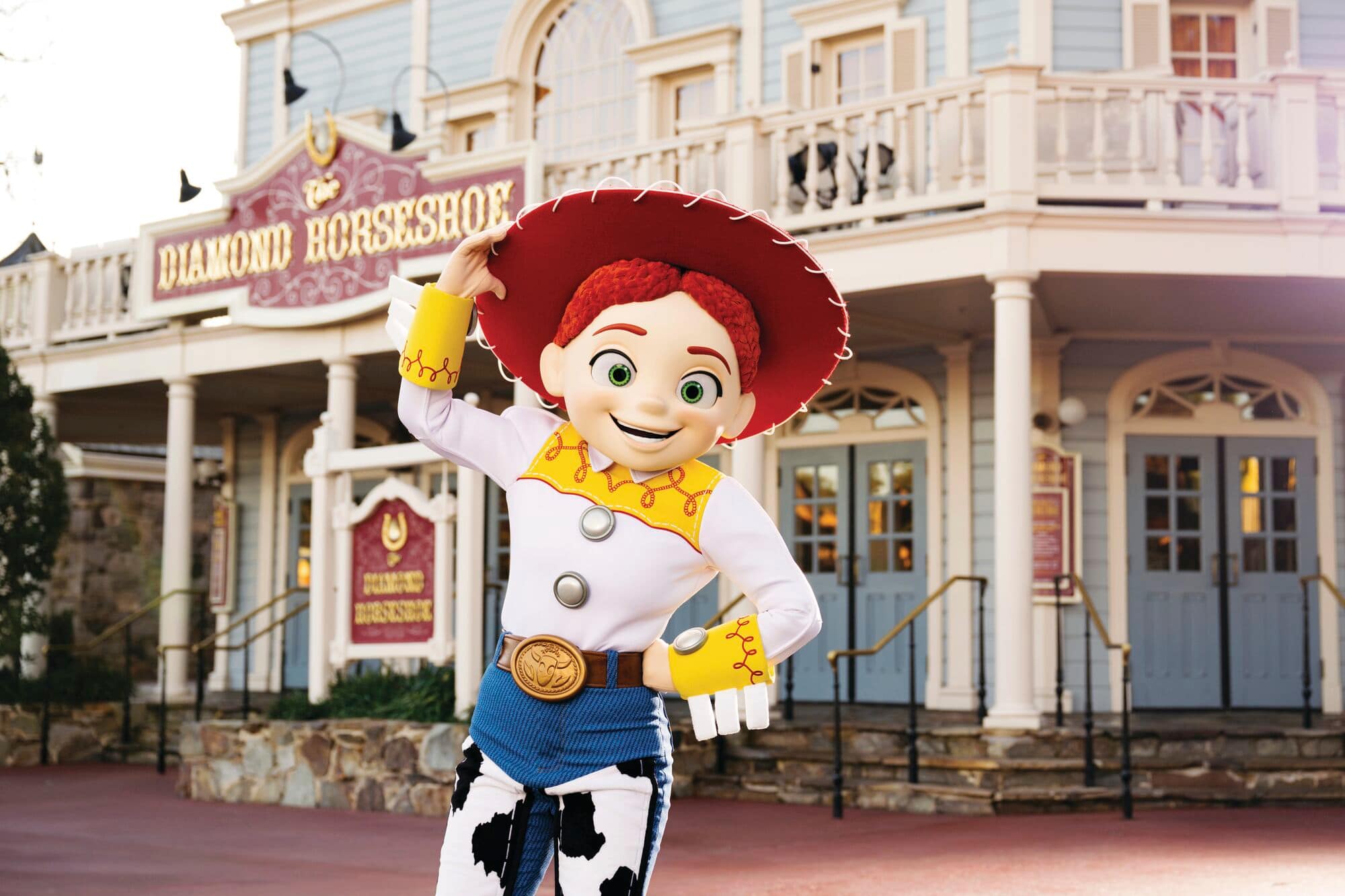 Jessie posing in front of the Wild West-themed Diamond Horseshoe building.