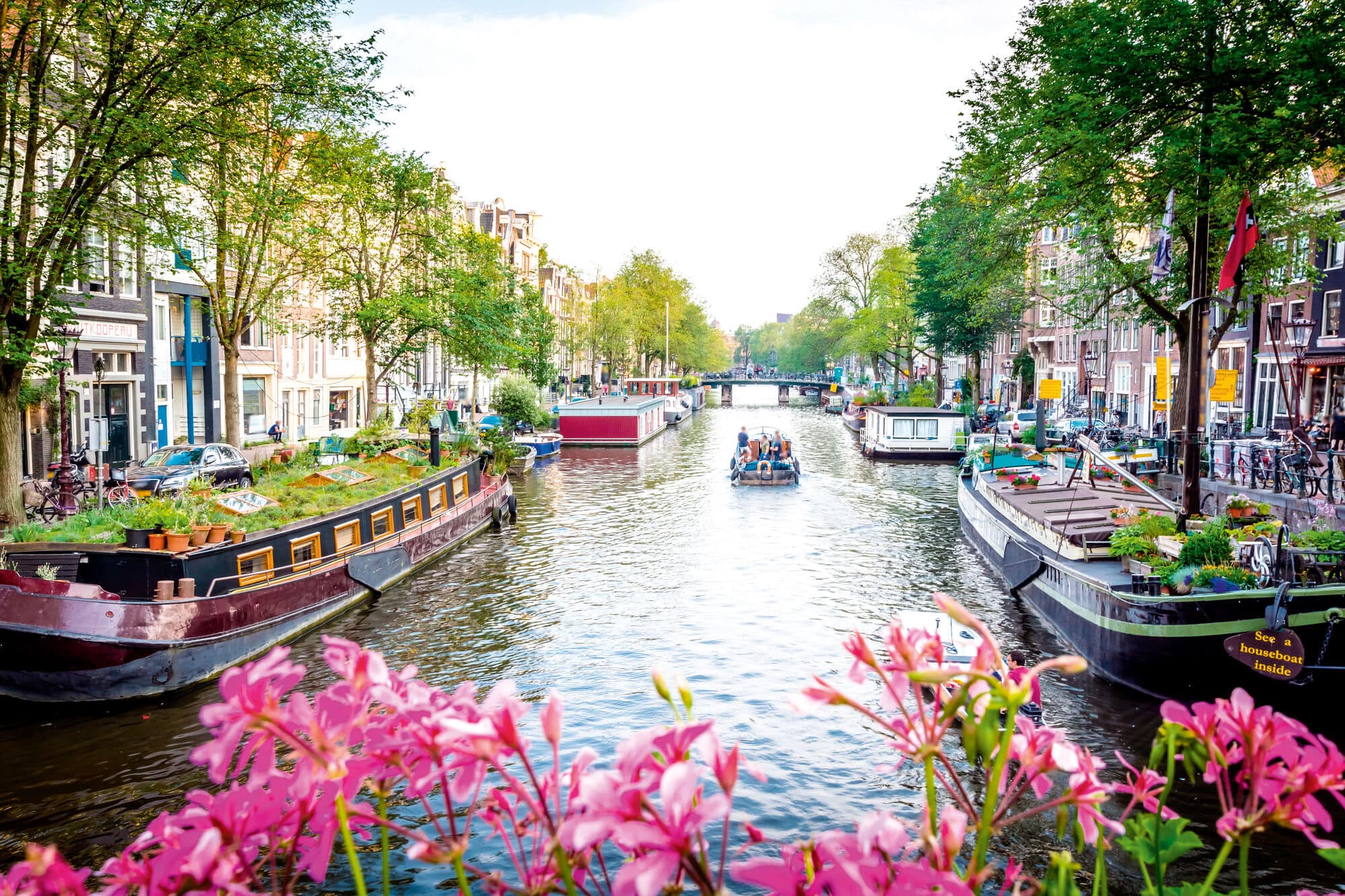 Boats sailing on the Amsterdam Canal.