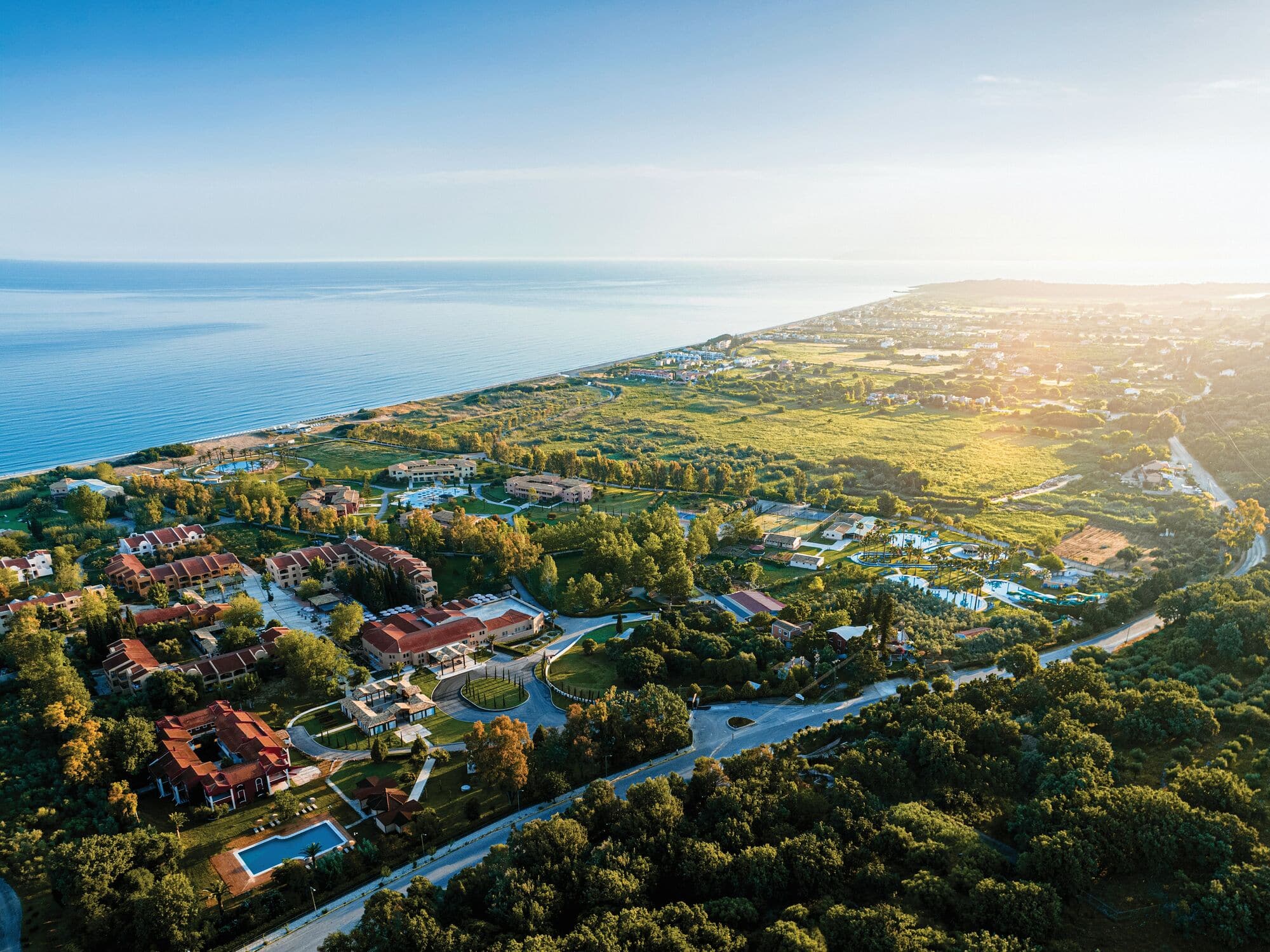 Overhead view of Grecotel LUX®ME Costa Botanica and the surrounding area.