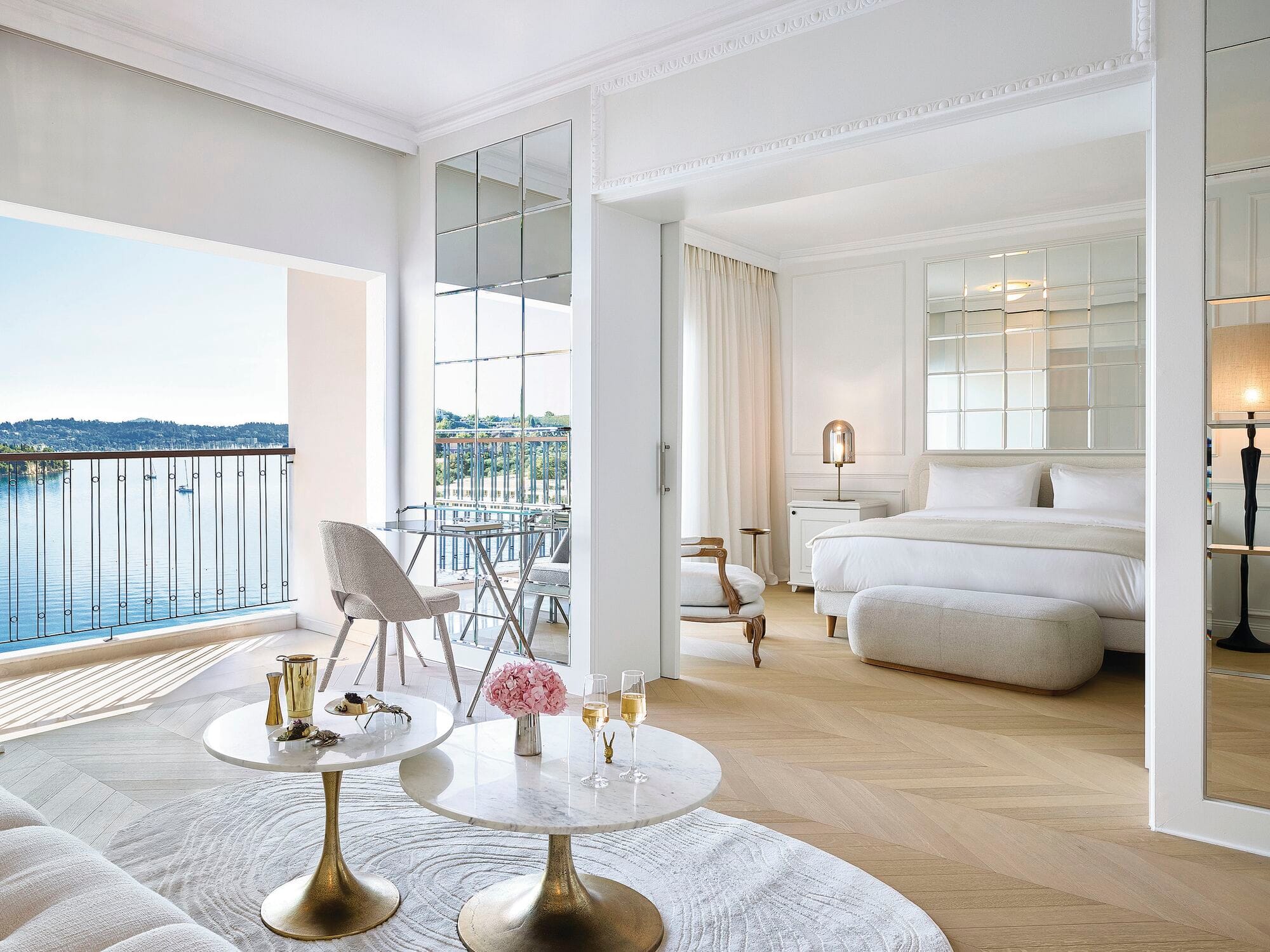 An open plan suite with a balcony and sea view. 
