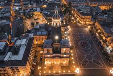 An aerial view of the mother church and Piazza Duomo at twilight