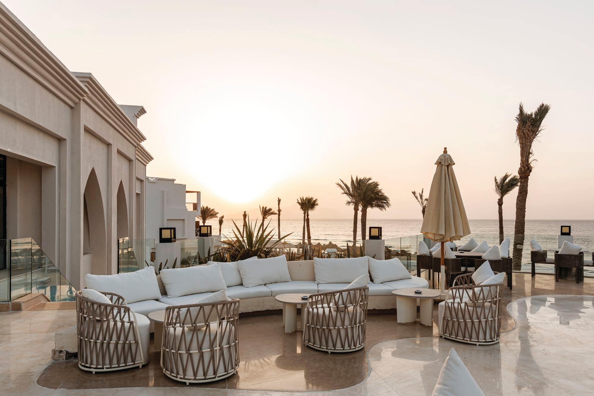 An outdoor seating area with a sea view.