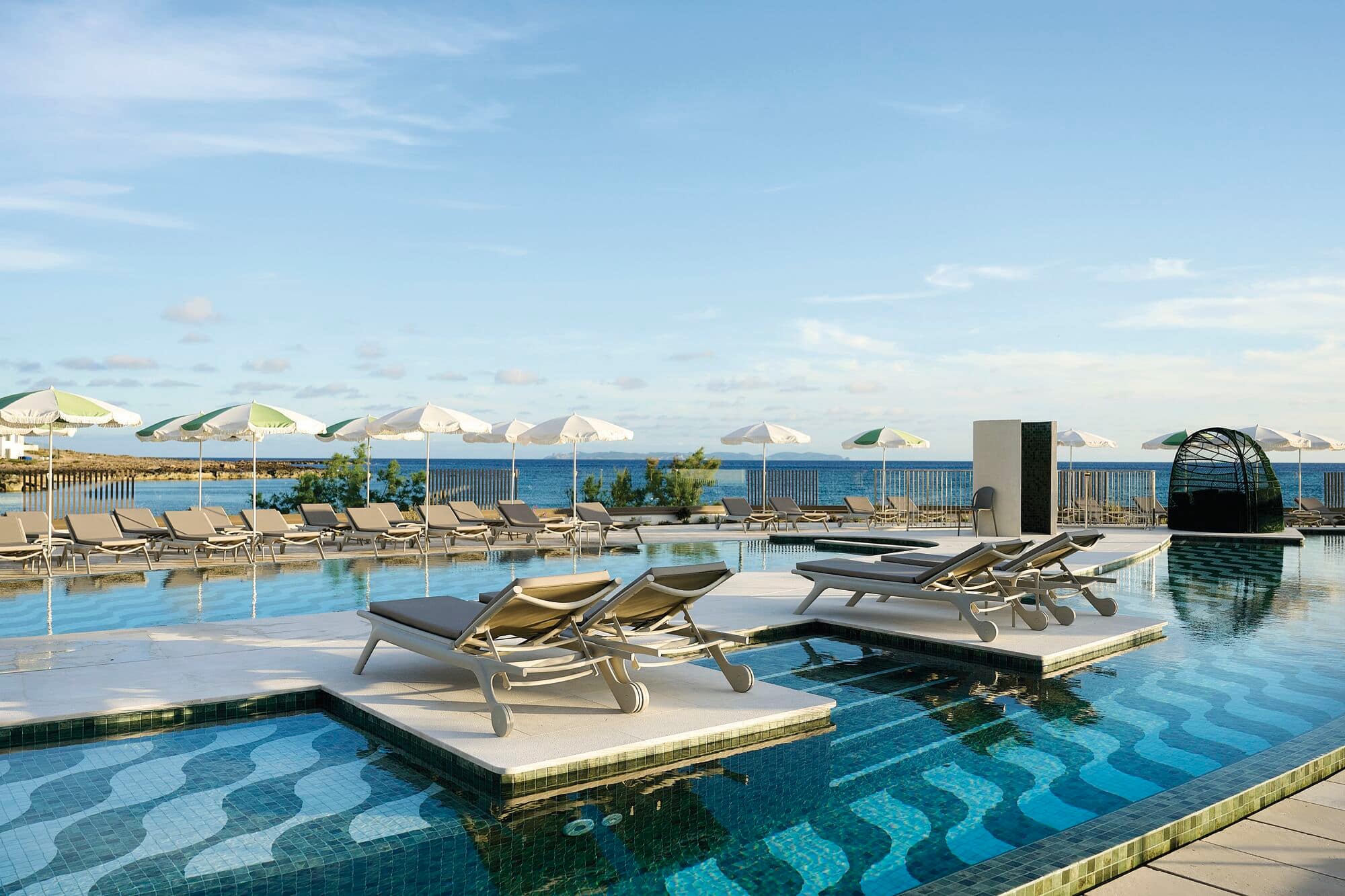 An infinity pool area at an Iberostar Hotel.