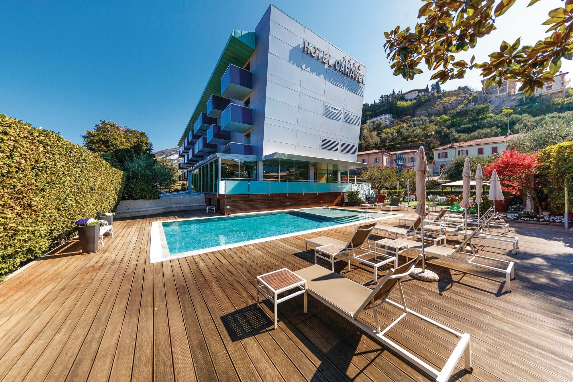 A pool set into a smart wooden deck at Hotel Caravel..