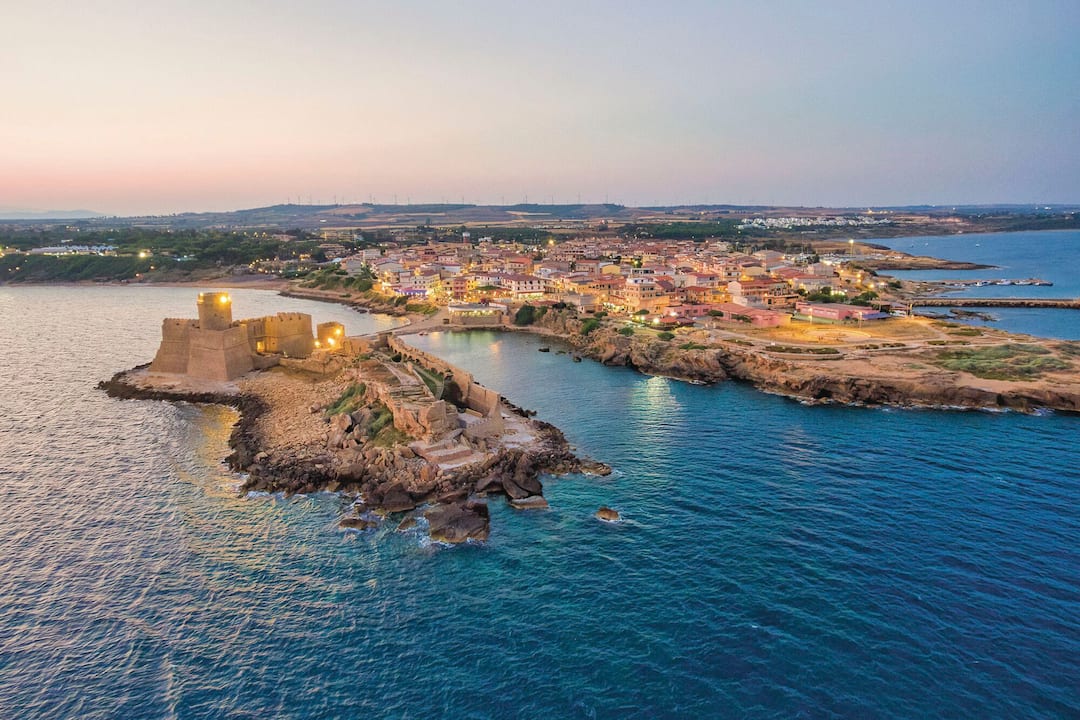 An aerial view of the castle and town at dusk