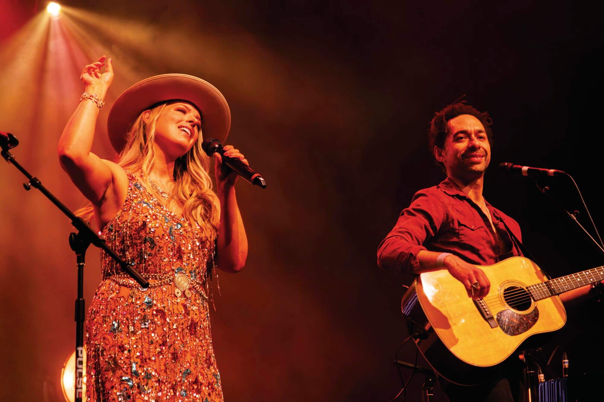 The Shires members performing on stage.