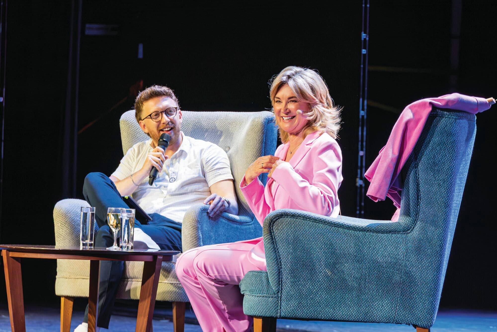 Anthea Turner being interviewed on a sofa.