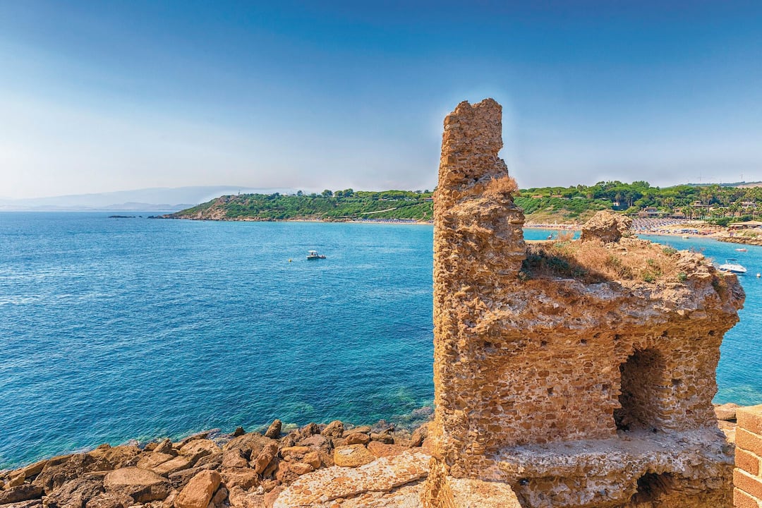 Looking along the coast, with a ruined tower in the foreground