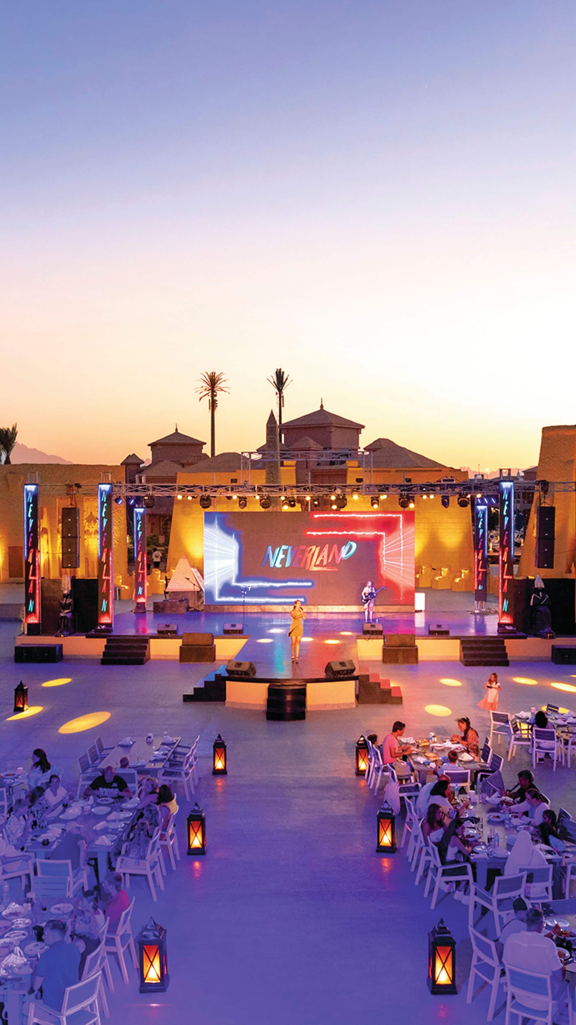 A seating area arranged in front of a stage.