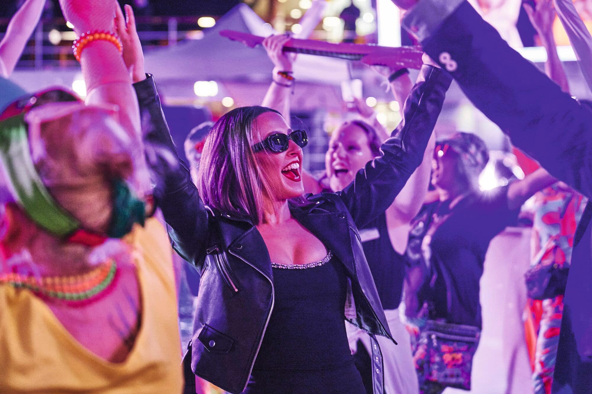Guests dancing at a 90s themed party.