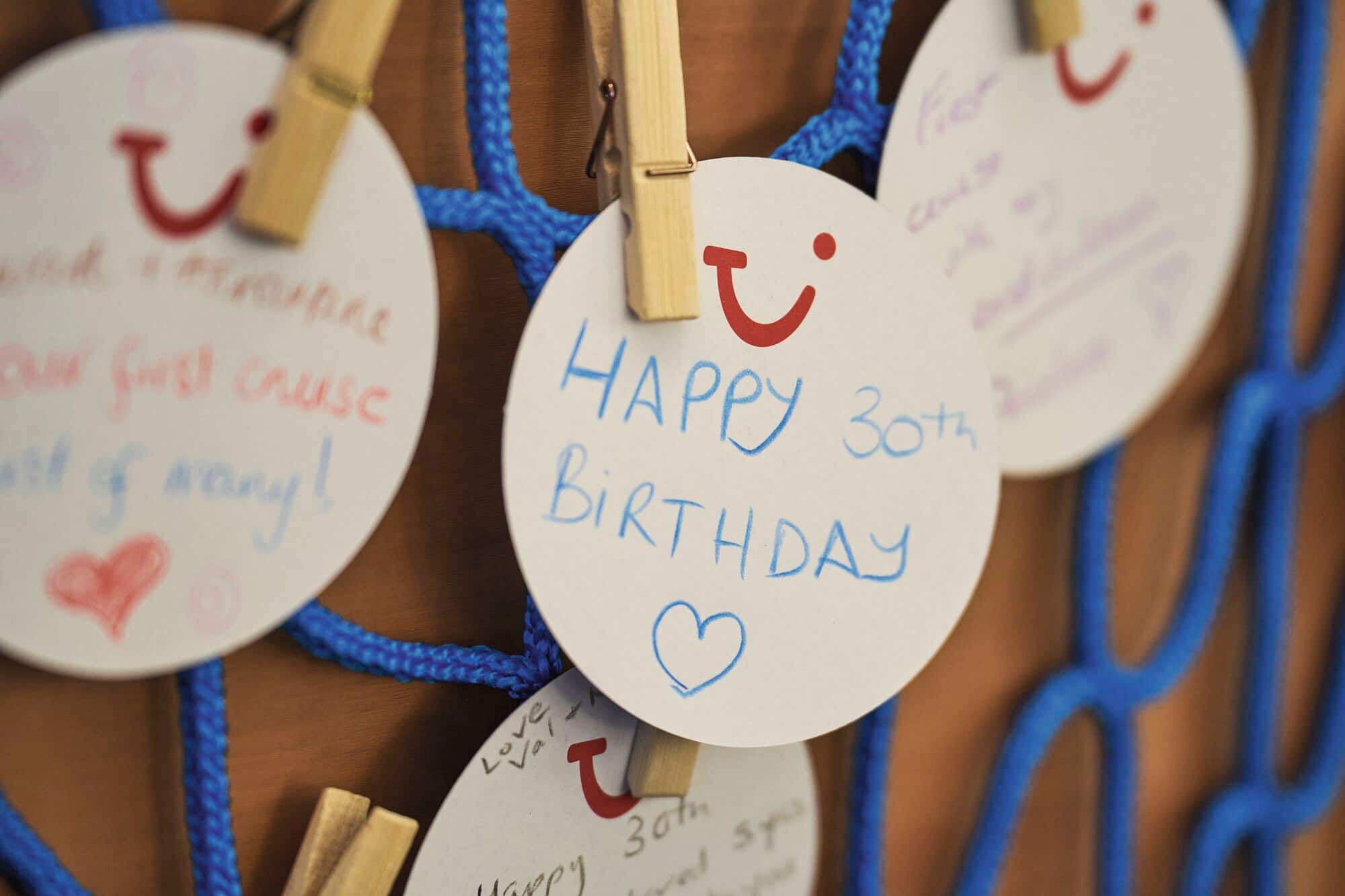 Circlular cards showing happy birthday messages from cruise guests.