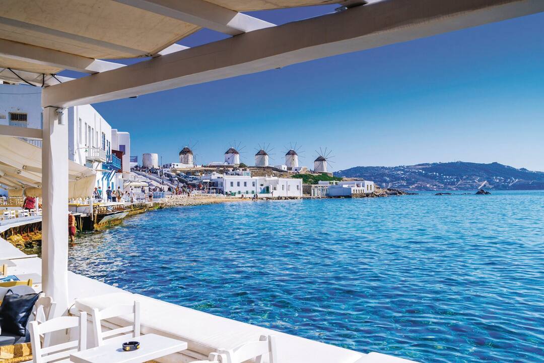 A restaurant with a view of Mykonos' windmills