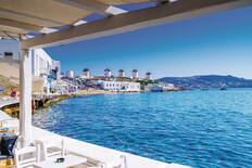 A restaurant with a view of Mykonos' windmills