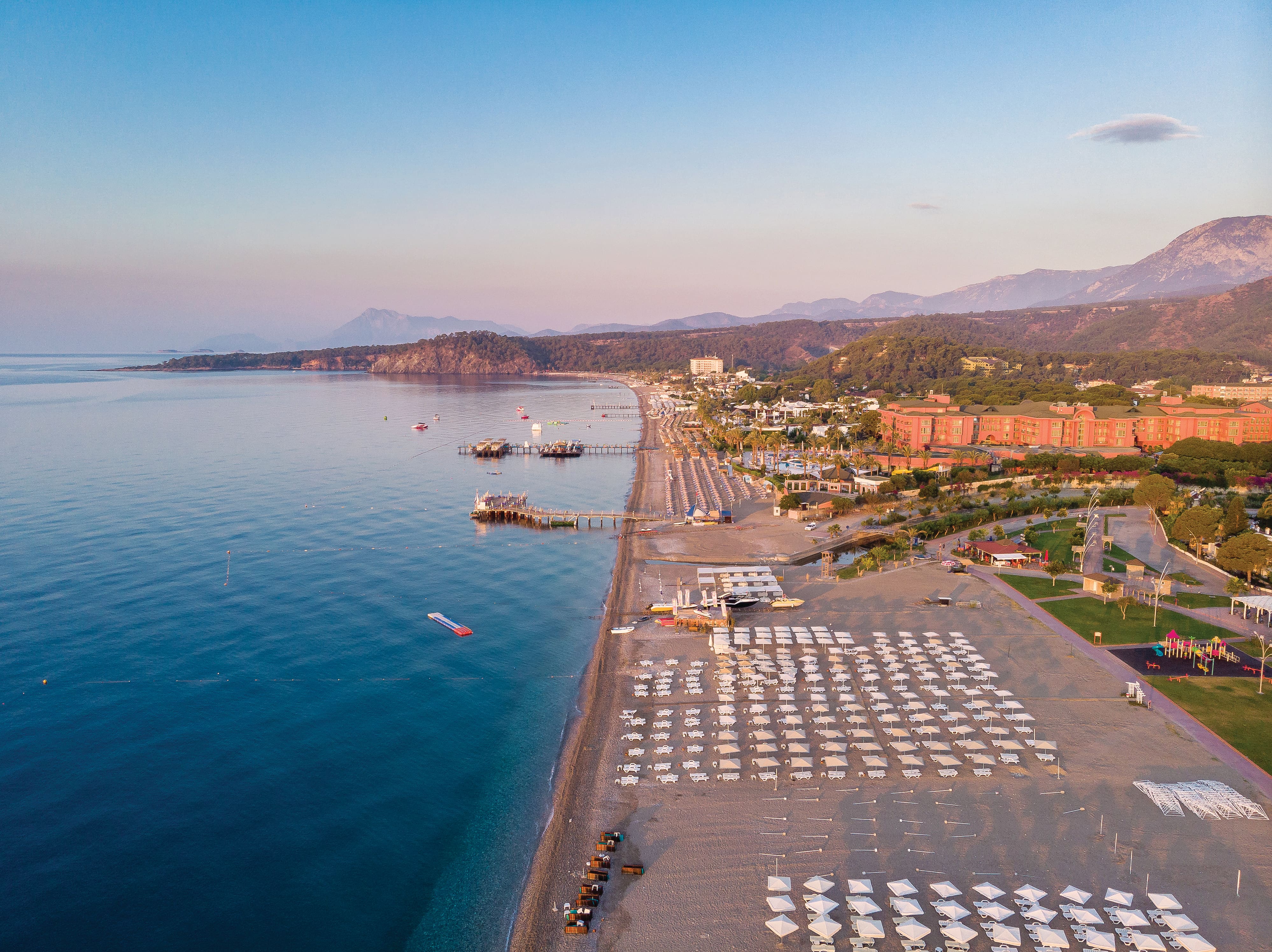 View from the sea to the village of Camyuva at sunrise.