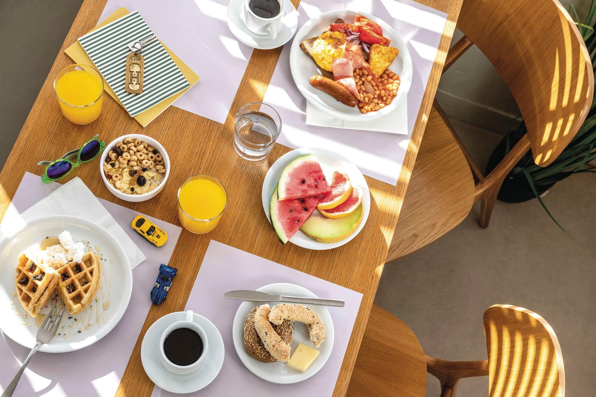 Top down view of table full of breakfast food.