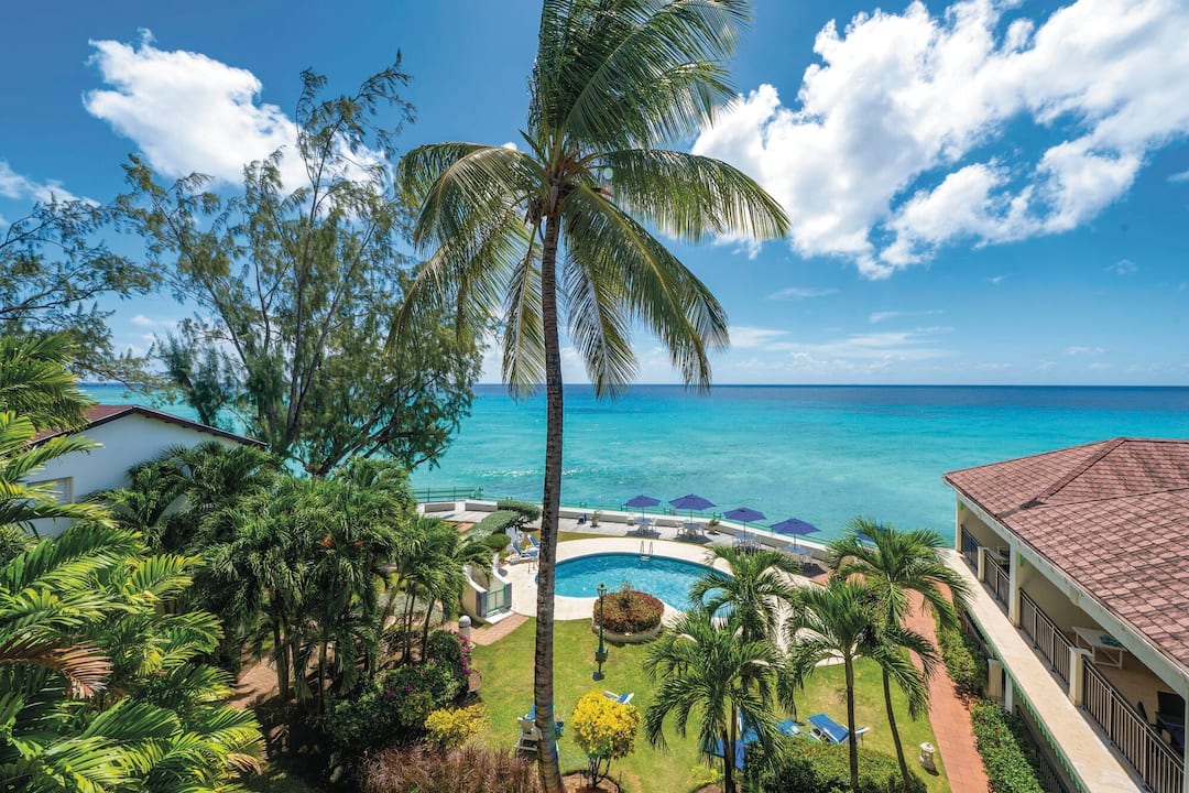 A view of the pool and sea beyond