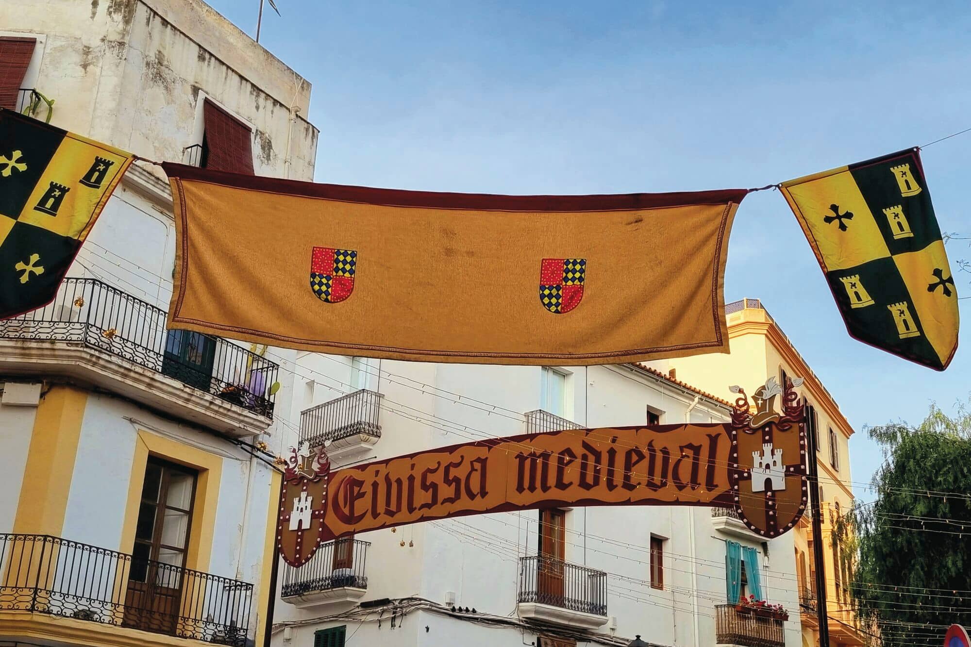Banners at the entrance to the town's medieval festival