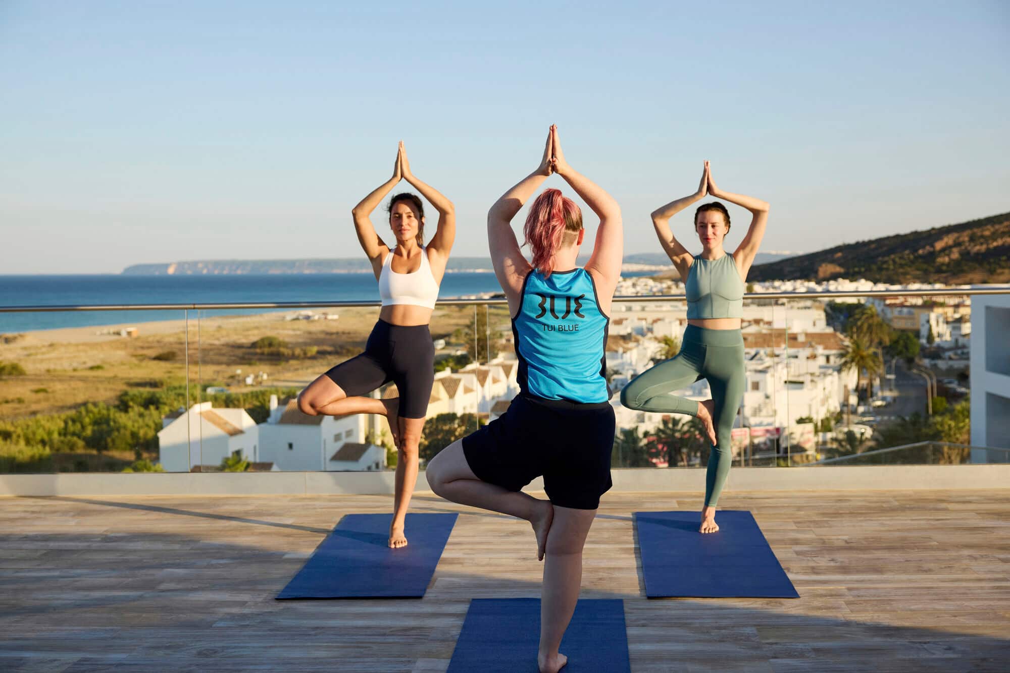 Guests taking part in a beach yoga class at TUI BLUE Matta Village in Andalucia. 