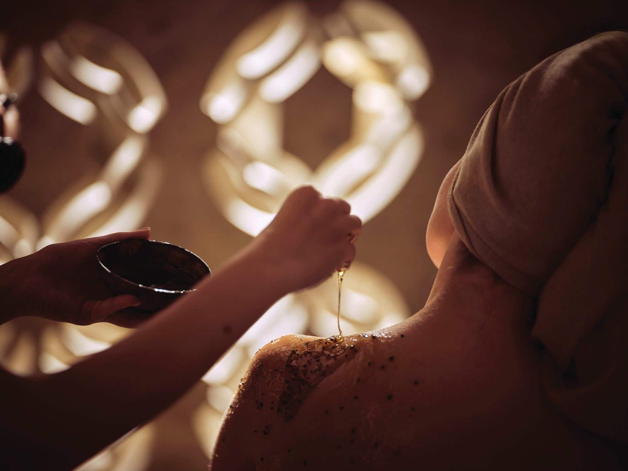 Luxury spa treatment with exfoliating body scrub.