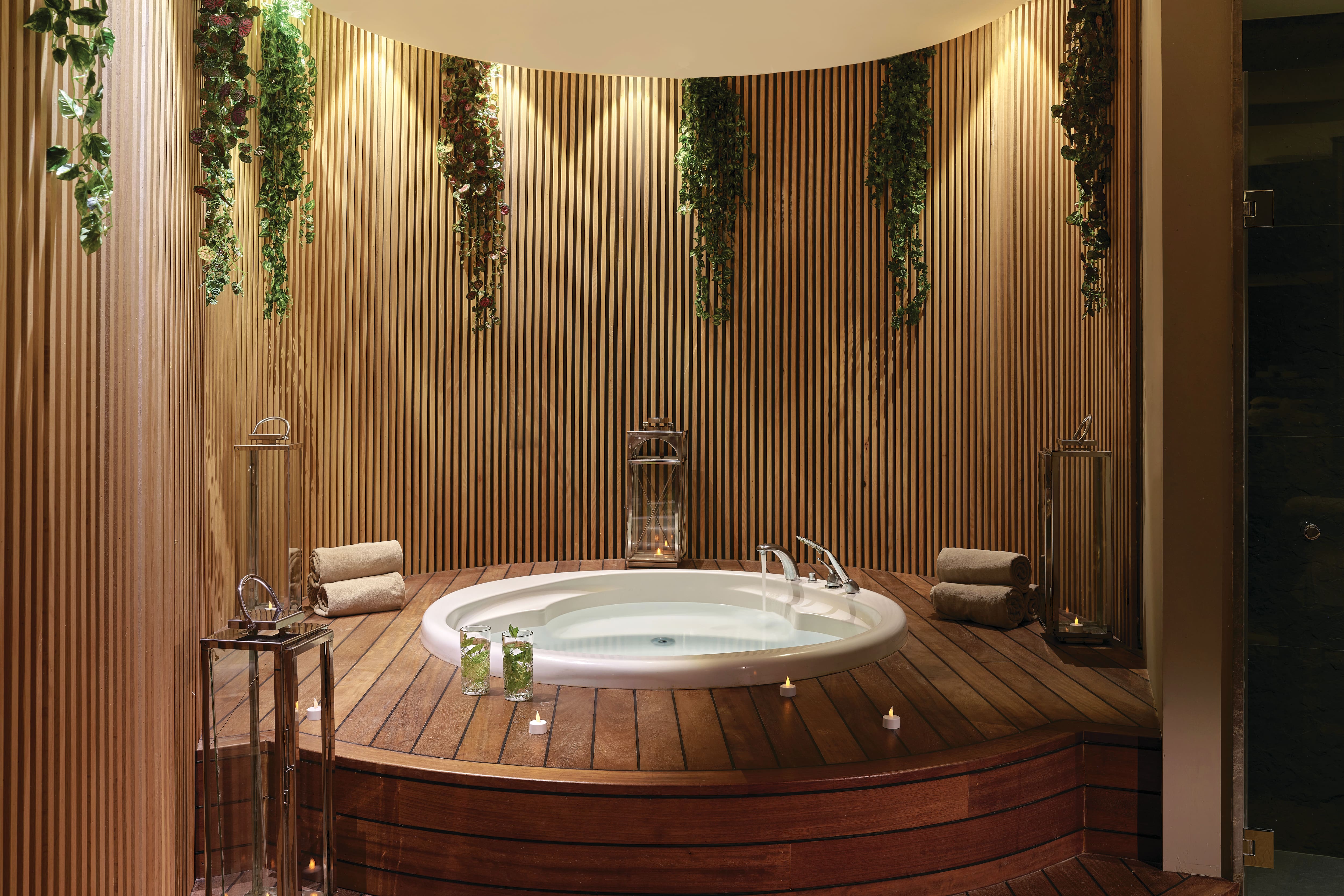 A luxury whirlpool spa surrounded by warm wood interiors at Lara Barut Collection.
