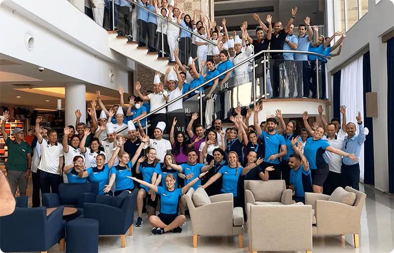 A big TUI team in a hotel lobby.