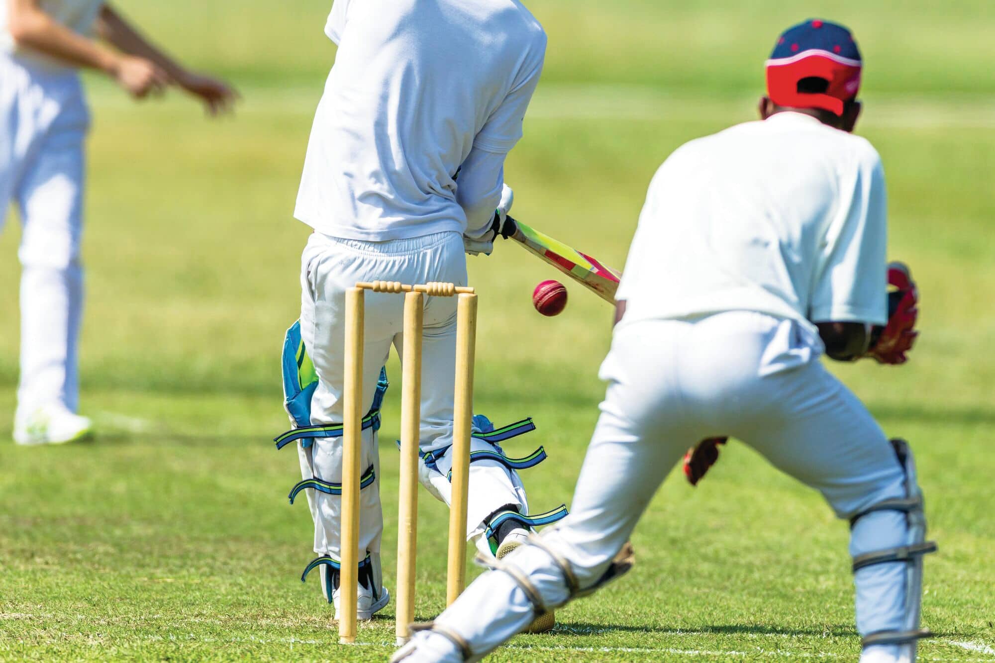 Batsman and wicketkeeper in a cricket game