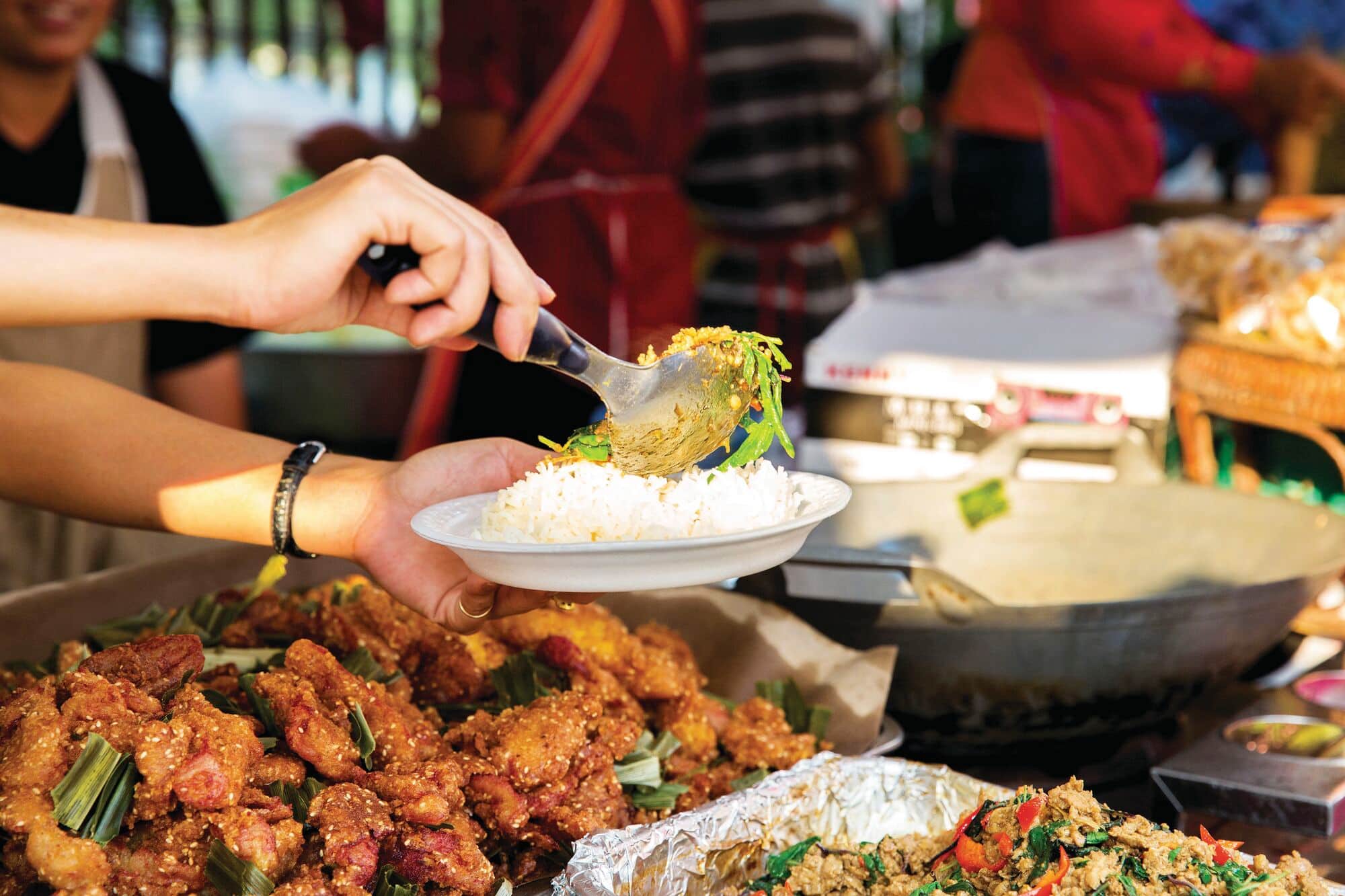Street food stall serving rice and local dishes