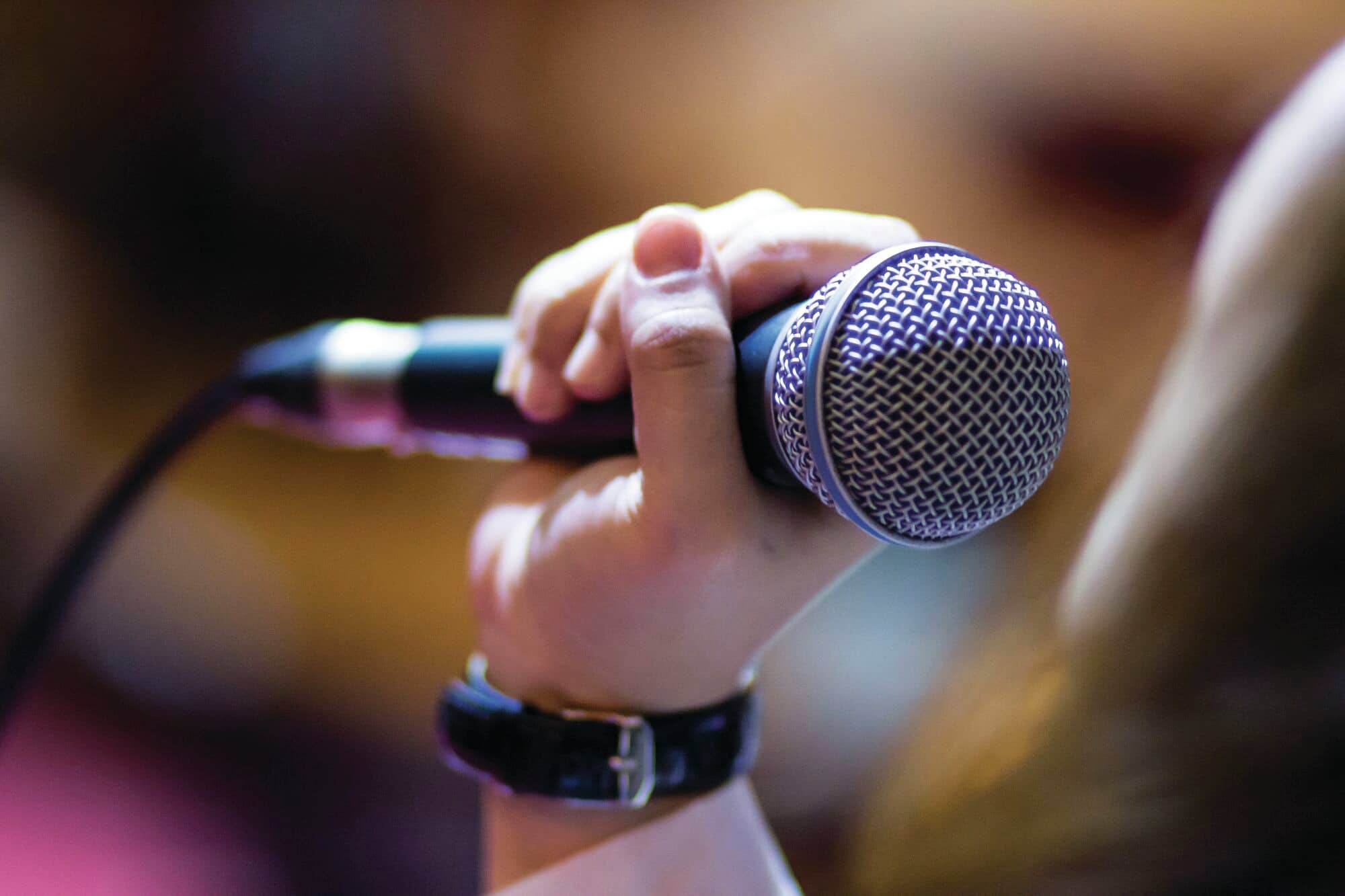 A person singing into a microphone