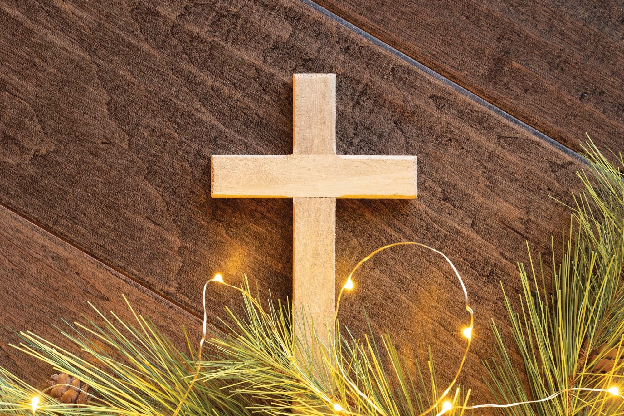 Wooden cross on a wooden table